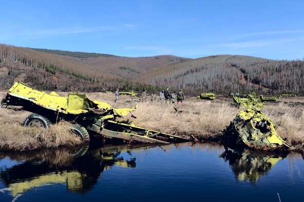 Air Force and Marine Explosive Ordnance Disposal personnel search around the target areas on the Yukon training area May 14 at Eielson Air Force Base, Alaska. The 354th Civil Engineer Squadron EOD shop, with the help of 60th EOD from Travis AFB, Calif., 509th EOD from Whiteman AFB, Mo., and Marines from the 1st EOD Company, Camp Pendleton, Calif., cleared 10,000 acres of land of hazardous inert and live ordnance. (U.S. Air Force Photo/Senior Airman Jonathan Snyder) 