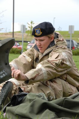 Tech. Sgt. Sarah Sell, from Security Forces, dresses in MOPP 2 while preparing for the ORI.  The ORI will take place in Alpena, MI in June. (photo by Staff Sgt. Emily Alley)