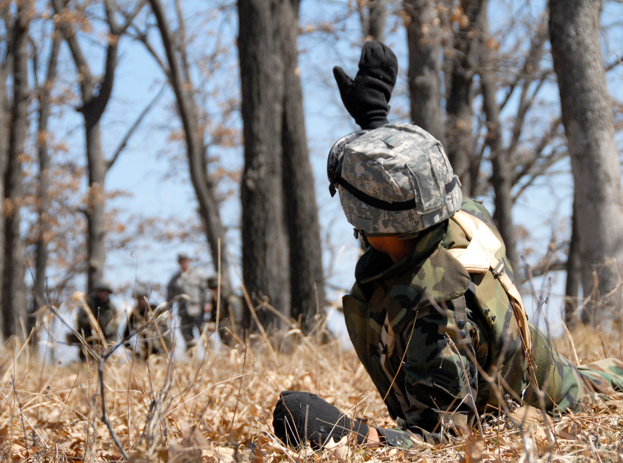 Senior Airman Lonnie Mitchell, Air National Guard - Band of the Northwest member, gives hand signals to his fellow band members during pre-deployment training at Volk Field Combat Readiness Training Center, Wis., April 17. A total of 30 ANG Band members from three different locations will deploy overseas in support of Operations Iraqi and Enduring Freedom. (U.S. Air Force Photo by Master Sgt. Dan Richardson)