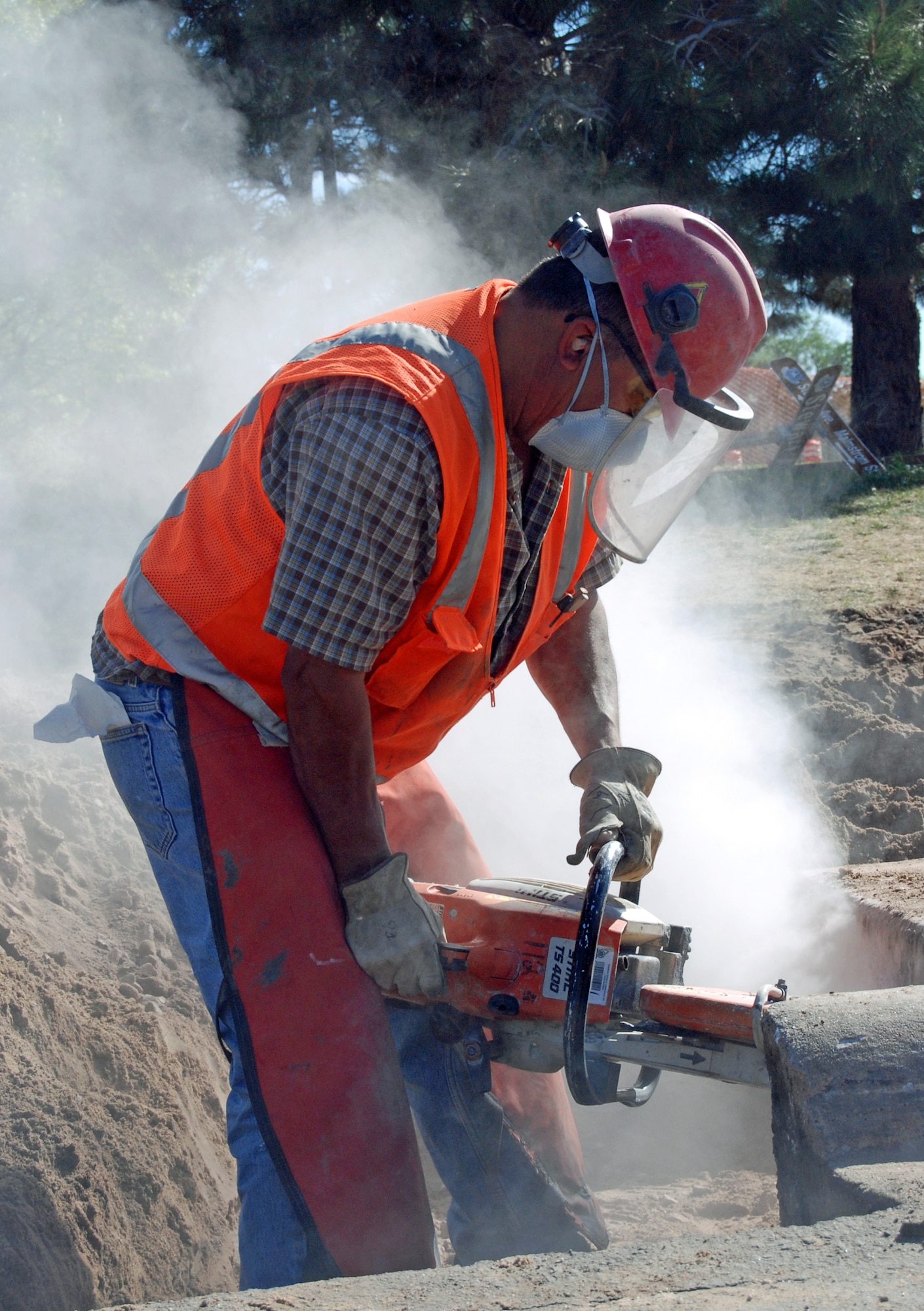 A Terra Vista Communities construction worker uses a demolition saw to slice through the top of a storm drain near Stewart and Malmstrom avenues May 19. Construction workers are widening the intersection to make room for the round-about. The roundabout’s first phase of construction included installing new storm sewers, concrete curbing and paving, has been completed. (Photo by Tech Sgt. Ray Bowden) 