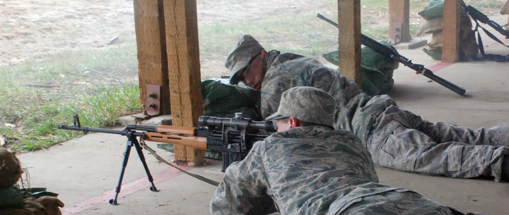 Cadets fired several antique weapons, including the sniper rifle shown here, during the U.S. Air Force Academy History Club's annual historical weapons shoot at Jacks Valley May 2. The 10th Mountain Division Living History Group gave presentation on the unit's participation in World War II. (U.S. Air Force photo/Ann Patton)