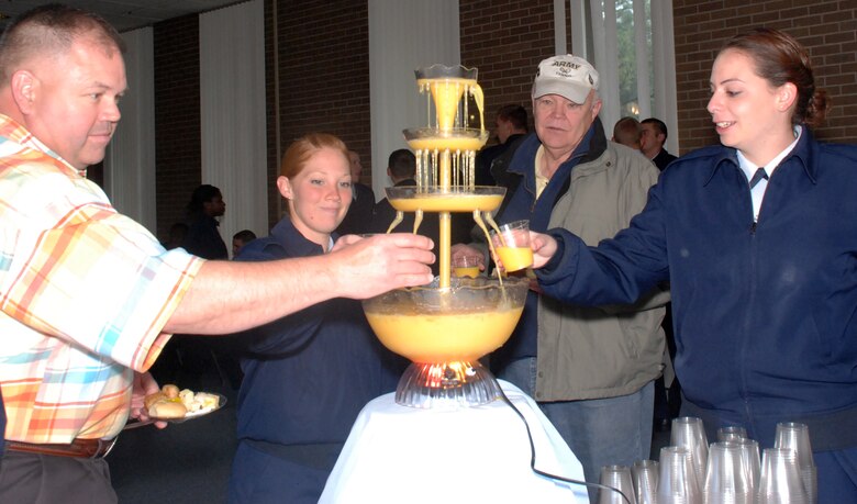 Cadet candidates and sponsors partake from a juice fountain during a sponsor appreciation reception in the U.S. Air Force Academy's Milazzo Club May 5. Anyone interested in sponsoring an Air Force Academy Preparatory School student should contact sponsor coordinator Cleo Griffith at 719-333-2583. (U.S. Air Force photo/Ann Patton)