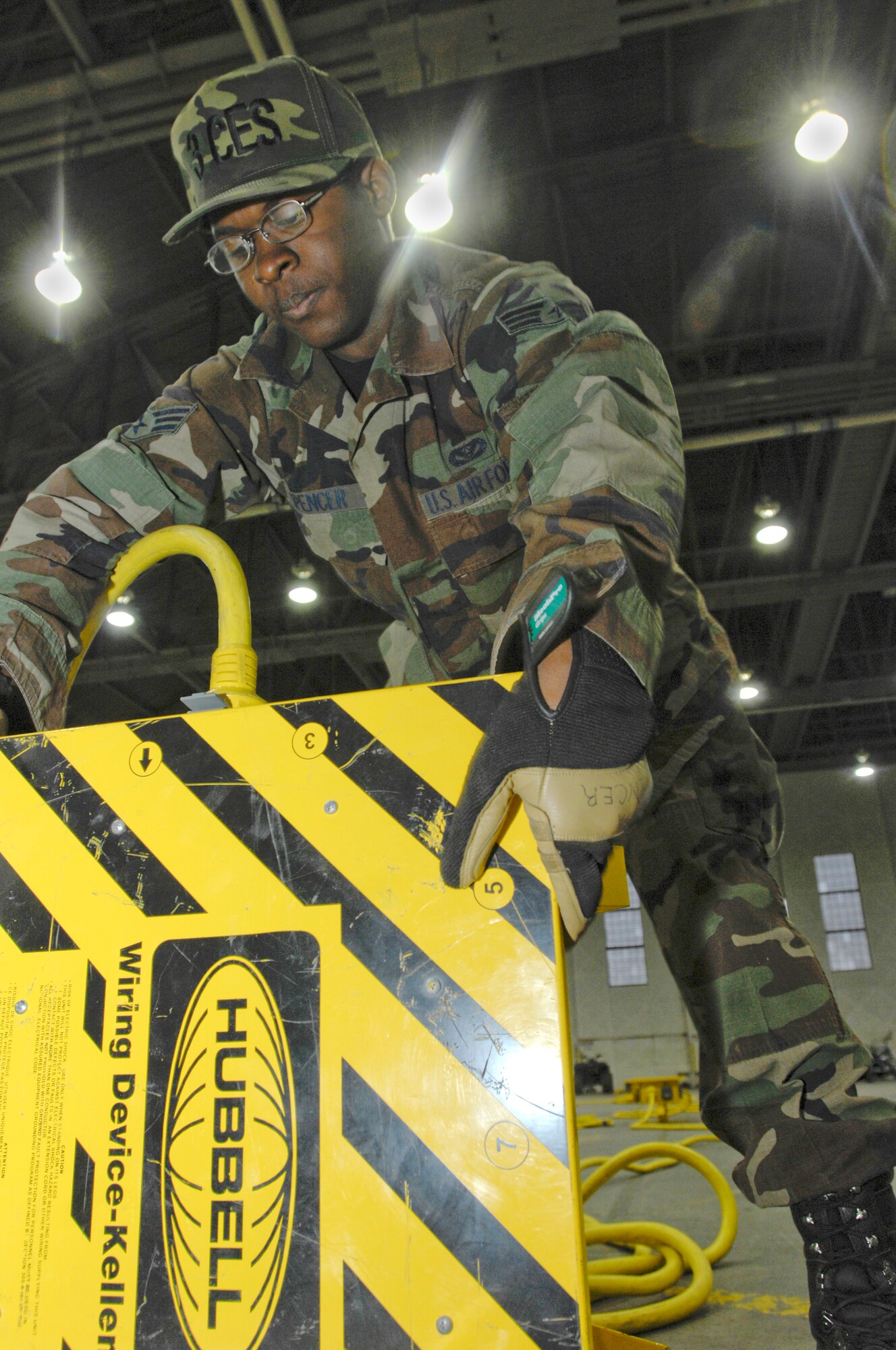 ELMENDORF AIR FORCE BASE, Alaska -- Senior Airman Sammie Spencer checks the settings of the spider box during the wing Safety Day May 15. Spencer is a member of 3rd Civil Engineer Squadron Electrical Flight. The Safety Day was a wingwide event that displayed safety items that Arctic Warriors could use during the Alaska summer. (U.S. Air Force photo/Senior Airman David Carbajal)