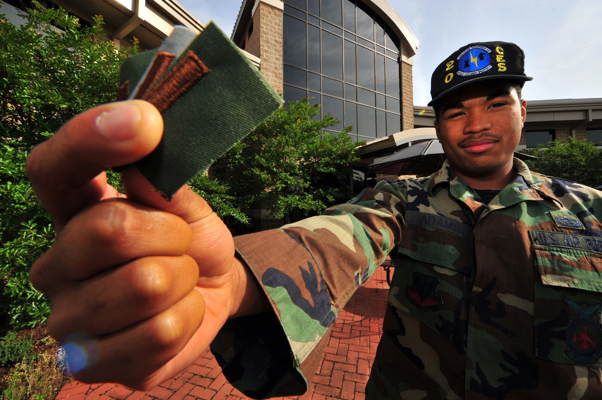 SHAW AIR FORCE BASE, S.C. -- U.S. Air Force Staff Sgt. Jamar Adams, 20th Civil Engineer Squadron fireman, holds up 2nd Lieutenant rank insignia for a photograph May 19, 2009. Adams is one of six enlisted personnel from Shaw selected for the Airman Education & Commissioning Program (AECP) this year. The AECP is a stripes to bars program that allows enlisted personnel to keep their active duty status as they earn their bachelor's degree. (U.S. Air Force photo by Senior Airman Kathrine McDowell/RELEASED)