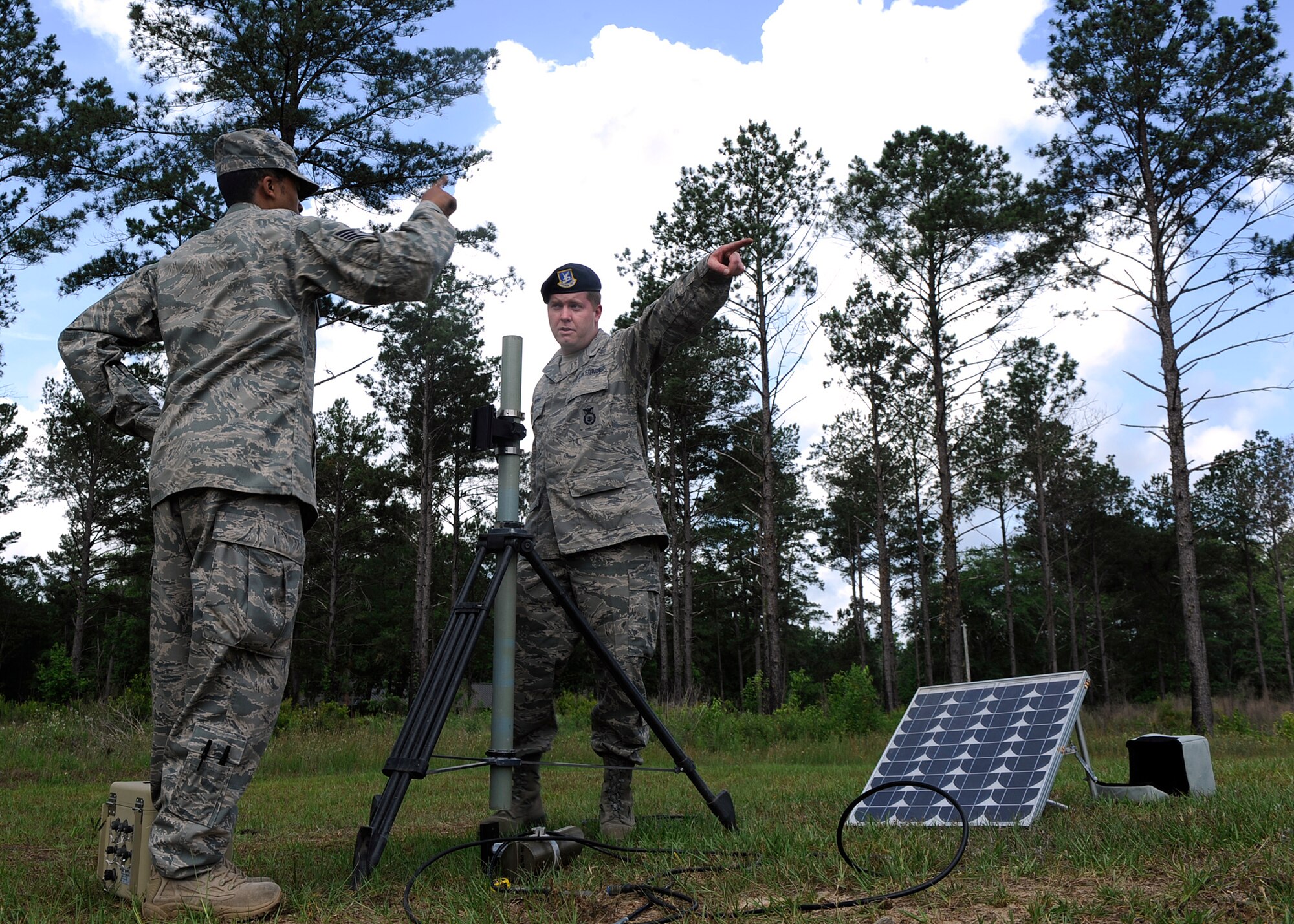 MOODY AIR FORCE BASE, Ga. -- Tech. Sgt. Jonathan Laury and Staff Sgt. James Banks, both members of the 16th Security Forces Squadron from Robins Air Force Base, Ga., set up sensors during an electronic security systems operators course here May 15. Staff Sgt. Michael Rice, 822nd Security Forces Squadron, taught the course to qualify three members of the 116th Security Forces Squadron on tactical automated sensor systems in preparation for an upcoming deployment. (U.S. Air Force photo by Senior Airman Brittany Barker)

