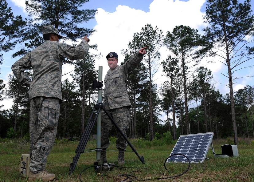MOODY AIR FORCE BASE, Ga. -- Tech. Sgt. Jonathan Laury and Staff Sgt. James Banks, both members of the 16th Security Forces Squadron from Robins Air Force Base, Ga., set up sensors during an electronic security systems operators course here May 15. Staff Sgt. Michael Rice, 822nd Security Forces Squadron, taught the course to qualify three members of the 116th Security Forces Squadron on tactical automated sensor systems in preparation for an upcoming deployment. (U.S. Air Force photo by Senior Airman Brittany Barker)

