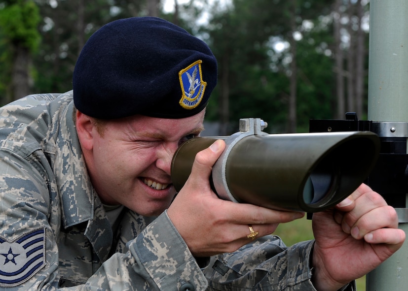 MOODY AIR FORCE BASE, Ga. -- Tech. Sgt. Jonathan Laury, a member of the 116th Security Forces Squadron from Robins Air Force Base, Ga., lines up sensors during an electronic security systems operators course here May 15. The sensors use infrared technology to set up security around equipment and the perimeters for bases. (U.S. Air Force photo by Senior Airman Brittany Barker)

