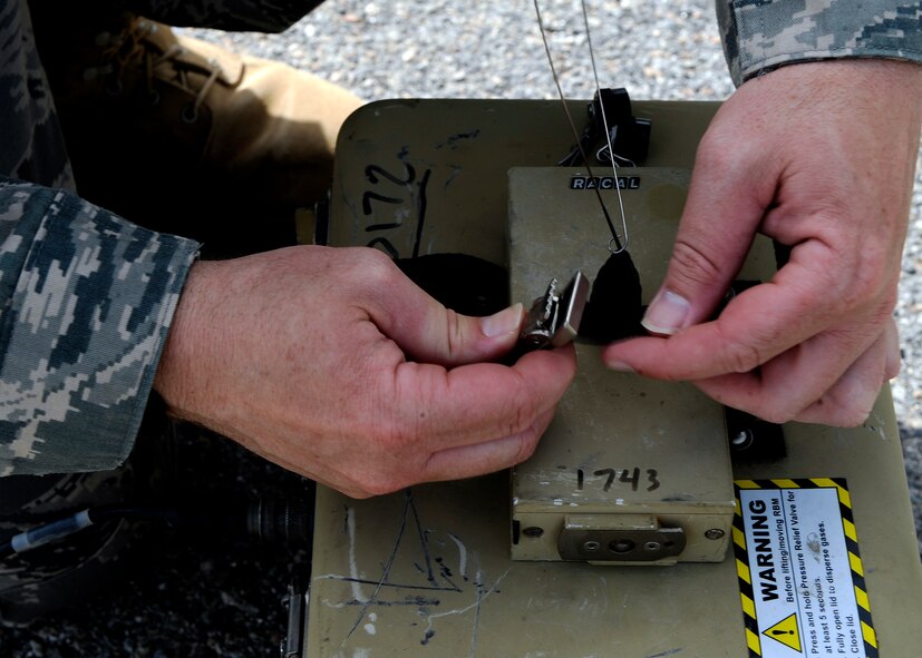 MOODY AIR FORCE BASE, Ga. -- Staff Sgt. David Laberis, a member of the 116th Security Forces Squadron from Robins Air Force Base, Ga., sets up a sensor during an electronic security systems operators course here May 15. The two week long course is being held for the first time at Moody. (U.S. Air Force photo by Senior Airman Brittany Barker)