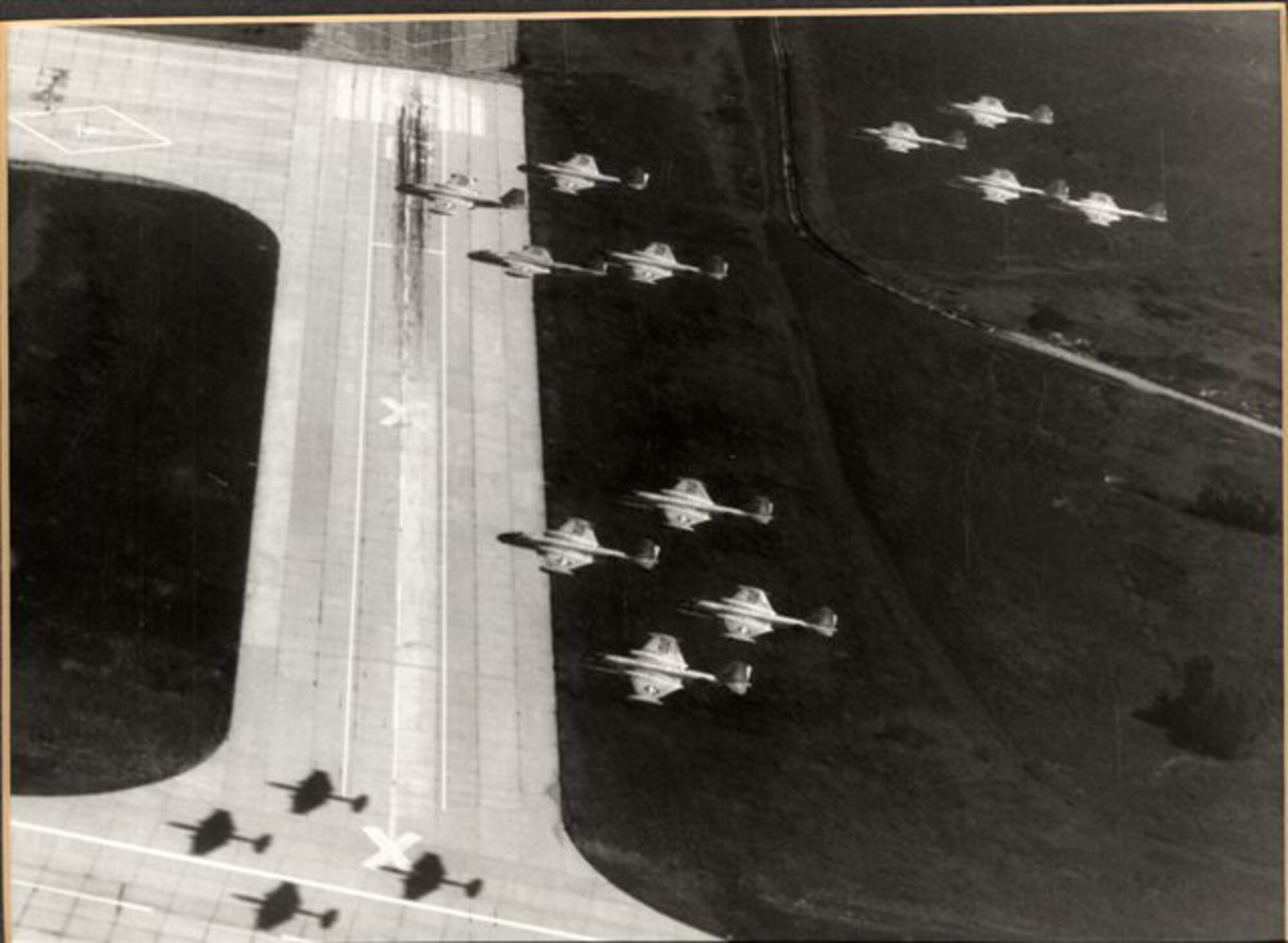 Twelve RB-57's from the 190th Tactical Reconnaissance Group fly over the end of the runway at Forbes Air Force Base on Friday, August 11, 1967. The V formation shown in the picture forms a traditional salute to the new home of the 190th.