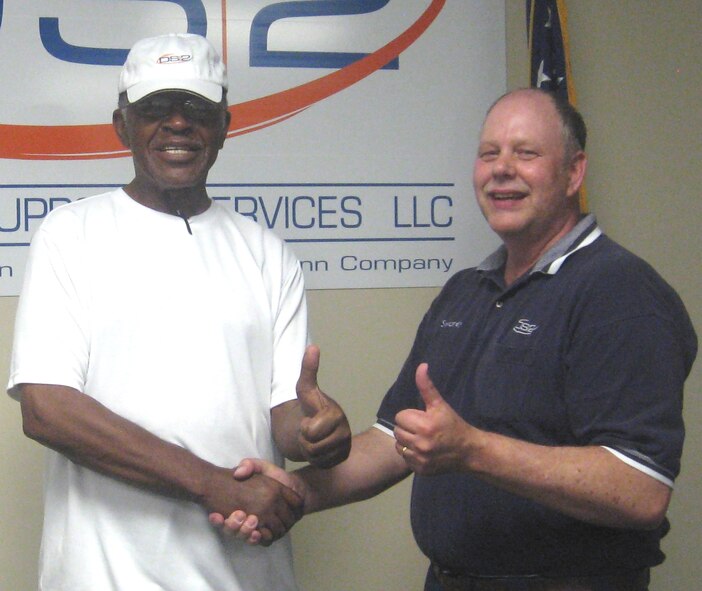 (Left) George Smith, retired Air Force technical sergeant and now city commissioner of Callaway, Fla., thanks Gerald Swanson, retired Air Force chief master sergeant and now training analyst with Defense Support Services, LLC, for saving his life April 28. Mr. Smith blacked out and collapsed at the Tyndall Fitness Center, prompting Mr. Swanson to administer the CPR which led to his recovery. (Courtesy photo/DS2) 
