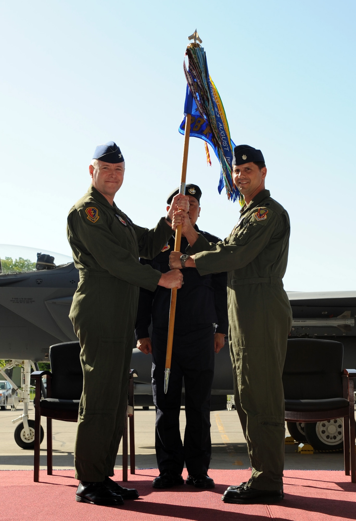 MOUNTAIN HOME AIR FORCE BASE, Idaho – Republic of Singapore air force Staff Sgt. Ricky Morier, 428th Fighter Squadron flightline crew, unveils Lt. Col. Keith Gibson and Maj. Robin Tan’s names on the side of an F-15SG during the reactivation and assumption-of-command ceremony May 18. The U.S. Air Force reactivated the 428th FS here as part of the Peace Carvin V program-- an international partnership between the United States and Republic of Singapore. The combined U.S. Air Force and Republic of Singapore air force unit will train RSAF aircrews in F-15SG fighters. (U.S. Air Force photo by Airman 1st Class Debbie Lockhart)