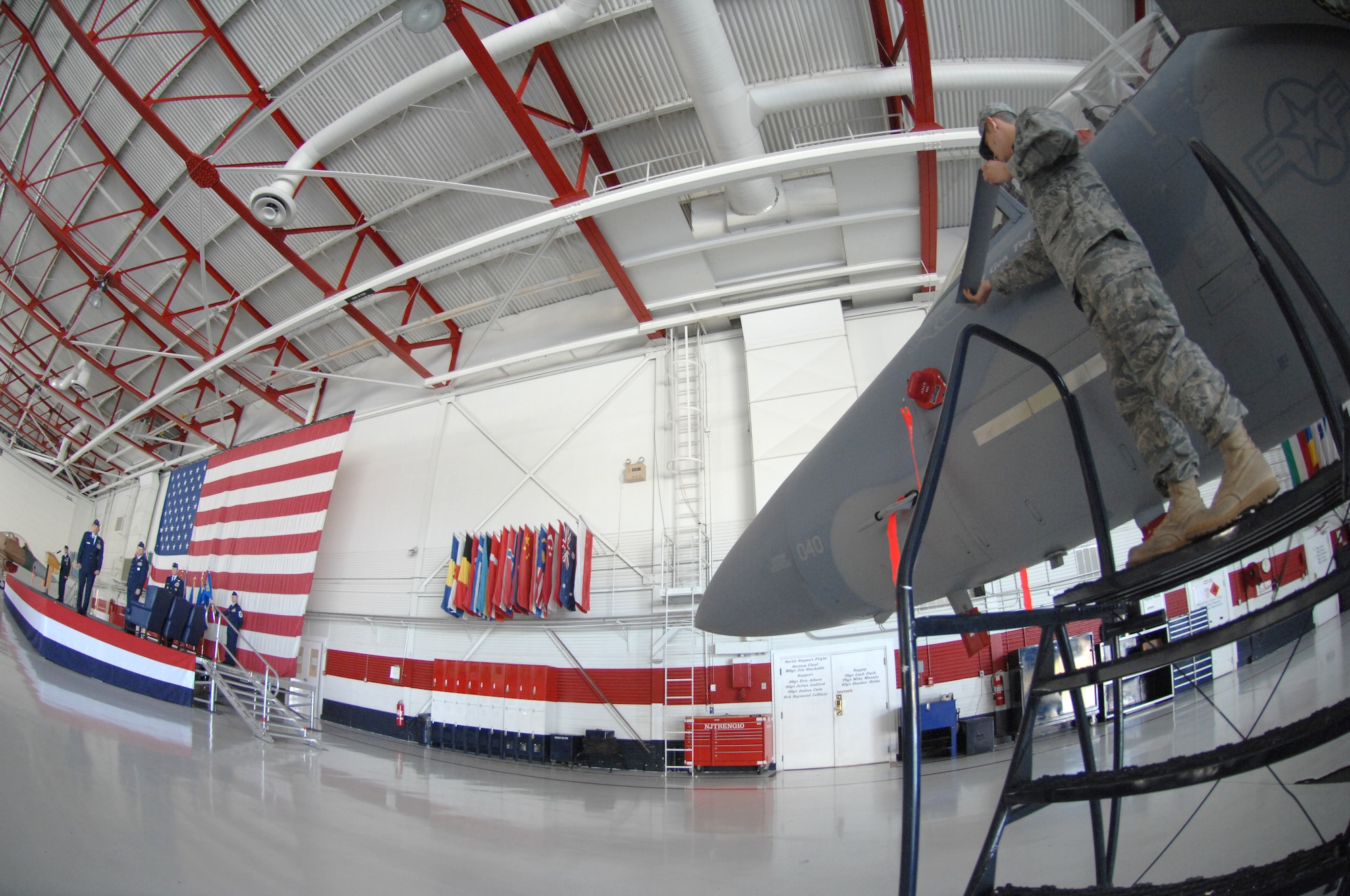 Staff Sgt. James Goodnight, an F-15 Strike Eagle crew chief assigned to the 57th Aircraft Maintenance Squadron, unveils Brig. Gen. Stanley Kresge's name plate on his jet during the U.S. Air Force Warfare Center change of command ceremony at Nellis AFB, Nev., May 18. Brig. Gen. Kresge assumes command of the USAFWC after being the Director of Air, Space and Nuclear Operations, Headquarters Air Force Space Command at Peterson AFB, Colo.
(U.S. Air Force Photo/Senior Airman Larry E. Reid Jr.)