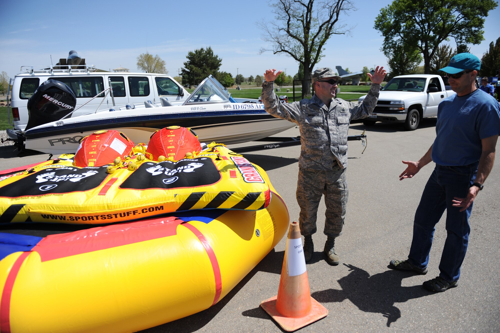 MOUNTAIN HOME AIR FORCE BASE, Idaho -- Chief Master Sgt. Ronald McCarthy, 366th Fighter Wing command chief, discusses boat safety with Mike Hurt, 366th Services Squadron outdoor adventure program coordinator, during Safety Day May 15. The base hosts a wing safety day once a year to educate people on proper safety techniques and to kick off the “101 Critical Days of Summer,” which runs from Memorial Day to Labor Day. (U.S. Air Force photo/ Senior Airman Ryan Crane)