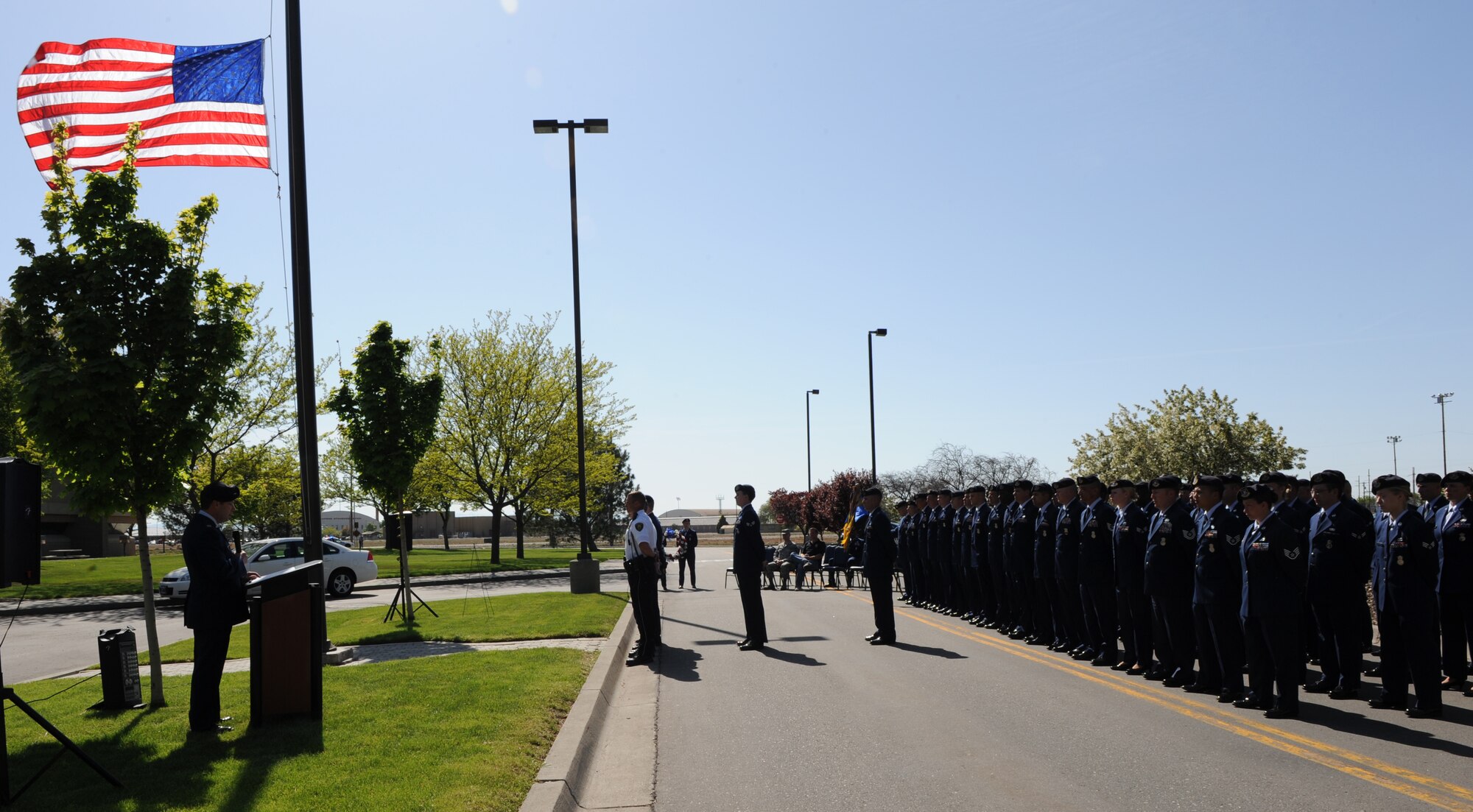 MOUNTAIN HOME AIR FORCE BASE, Idaho-- Members of the 366th Security Forces Squadron stand at parade rest during retreat while the flag is lowered signaling the end of the duty day, in appreciation of National Police Week May 15. The week is to honor personnel in law enforcement and pay tribute to those who gave their lives while serving their community. (U.S. Air Force photo/ Airman 1st Class Renishia Richardson)