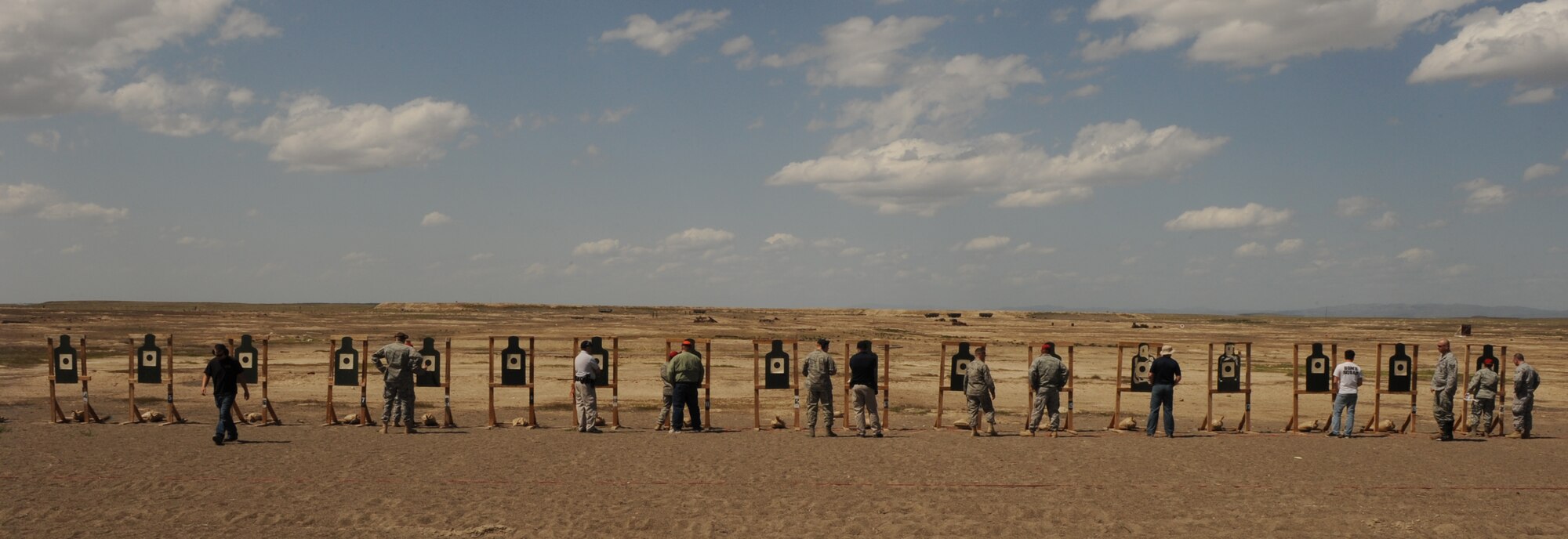 MOUNTAIN HOME AIR FORCE BASE, Idaho -- Participants total up their scores during the "Bulls Eye" pistol challenge May 11 in appreciation of National Police Week. The week honors personnel in law enforcement and pay tribute to those who gave their lives while serving their community. (U.S. Air Force photo/ Airman 1st Class Renishia Richardson)