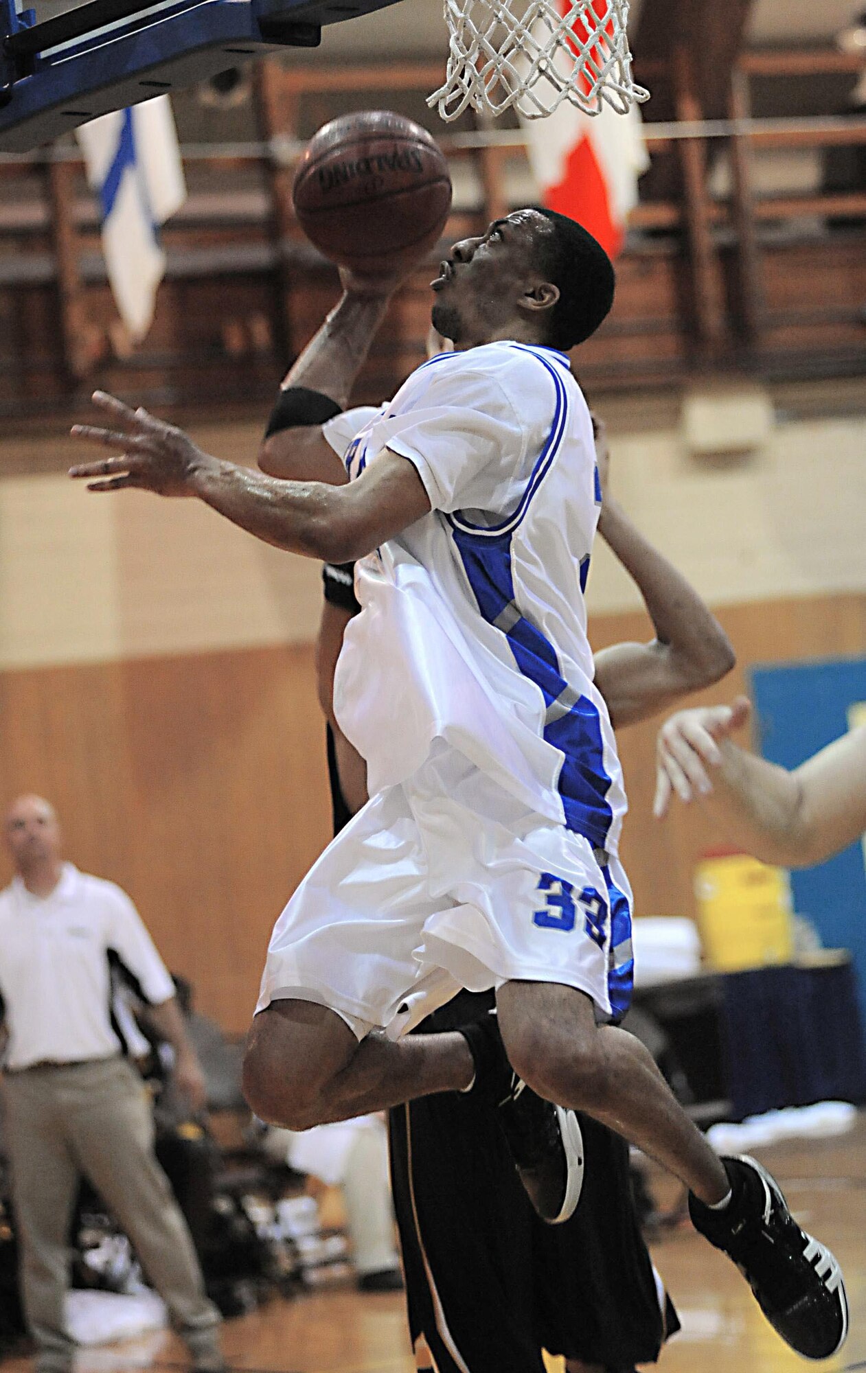 Staff Sgt. Marico Gray, from Nellis Air Force Base, Nev., drives the ball to the basket for two points during a basketball game against the Army.  The Air Force men beat Army 70-56 during the fourth day of games for the Armed Forces Basketball Championship. The tournament ran from May 12 to 17 at the Naval Support Activity Mid-South in Millington, Tenn.  (U.S. Navy photo/Petty Officer 1st Class John Collins)