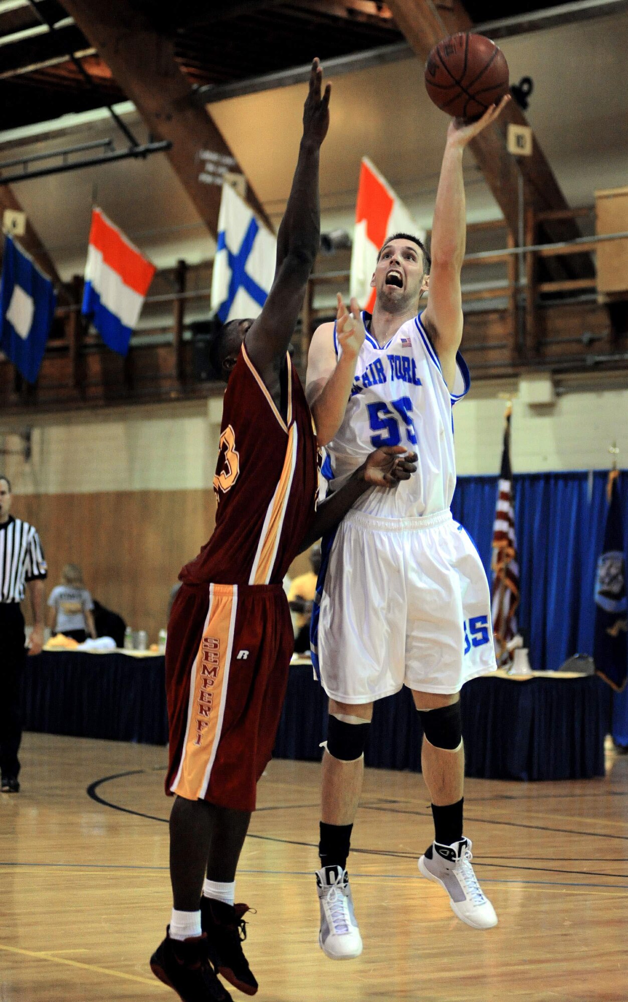 Second Lt. John Frye, from Schriever Air Force Base, Colo., shoots over a defender for two points during a basketball game against the Marine Corps.  Frye scored seven points and had two rebounds during the 86-67 victory over the Marines in the second round of games for the Armed Forces Basketball Championship.  The tournament ran from May 12 to 17 at the Naval Support Activity Mid-South in Millington, Tenn.  (U.S. Navy photo/Petty Officer 1st Class John Collins)