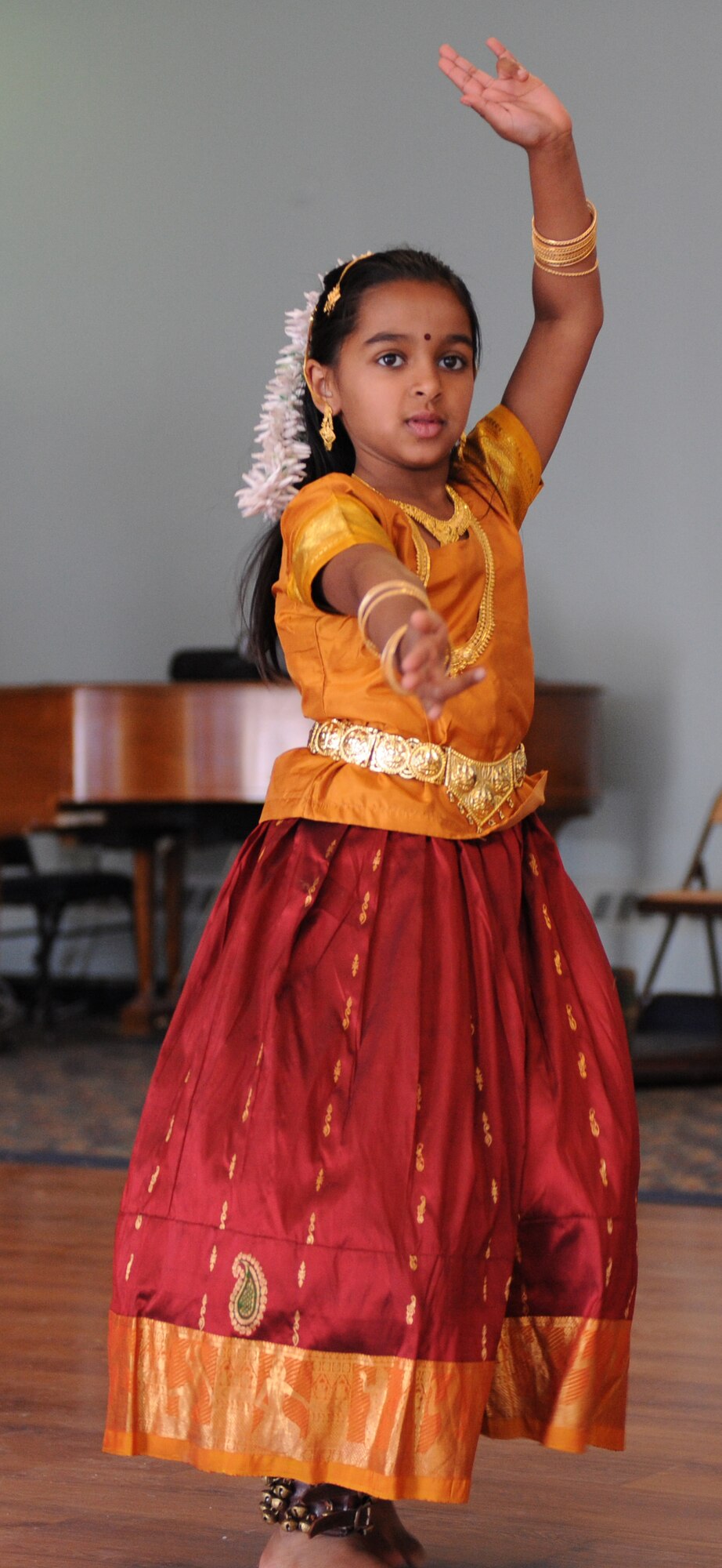 MOUNTAIN HOME AIR FORCE BASE, Idaho -- Sahana Vasudevan performs a South Indian classical dance called "Natesha Kautubham" at the community center May 16 Sights and Sounds of Asia and the Pacific Islands. Sahana danced in support of the month-long Asian-Pacific celebration. Each May, the base joins other installations and organizations across the nation to celebrate Asian Pacific American Heritage and honor the contributions these Americans made throughout U.S. history. (U.S. Air Force photo/ Airman 1st Class Renishia Richardson)