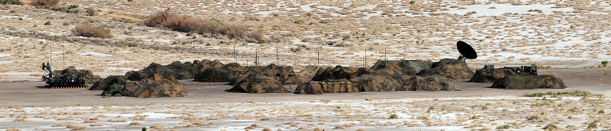WENDOVER, Utah -- The 726th Air Control Squadron compound sits hidden by camouflage netting during a week-long exercise in Wendover, Utah, during a week-long training exercise. The 726th ACS tackles a wide-spread mission including enemy surveillance and identification, weapons control, joint and combined data-link connectivity, and battle management of offensive and defensive air activities. The squadron is made up of 27 different Air Force career fields, making it self-sustaining and able to deploy and fully operate without external support or help. (U.S. Air Force photo\Airman 1st Class Debbie Lockhart)