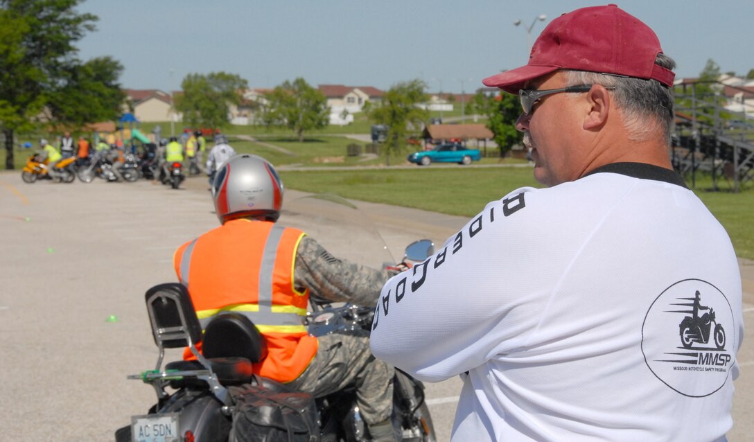 Master Sgt. Chuck Cousins observes motorcycle riders at Whiteman Air Force Base, Mo., navigate the motorcycle-safety course during Safety Day at Whiteman May 18, 2009. Sergeant Cousins is an Air Force Reservist in the 442nd Maintenance Operations Flight and a certified rider coach and motorcycle-safety instructor. (U.S. Air Force photo/Master Sgt. Bill Huntington)