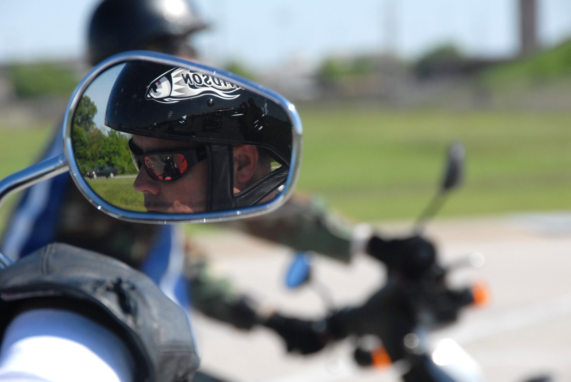 A participant in the motorcycle-safety course during a safety day at Whiteman Air Force Base, Mo., is reflected in the rear-view mirror of his motorcycle. The entire base observed a safety day May 18, 2009.  (U.S. Air Force photo/Master Sgt. Bill Huntington)