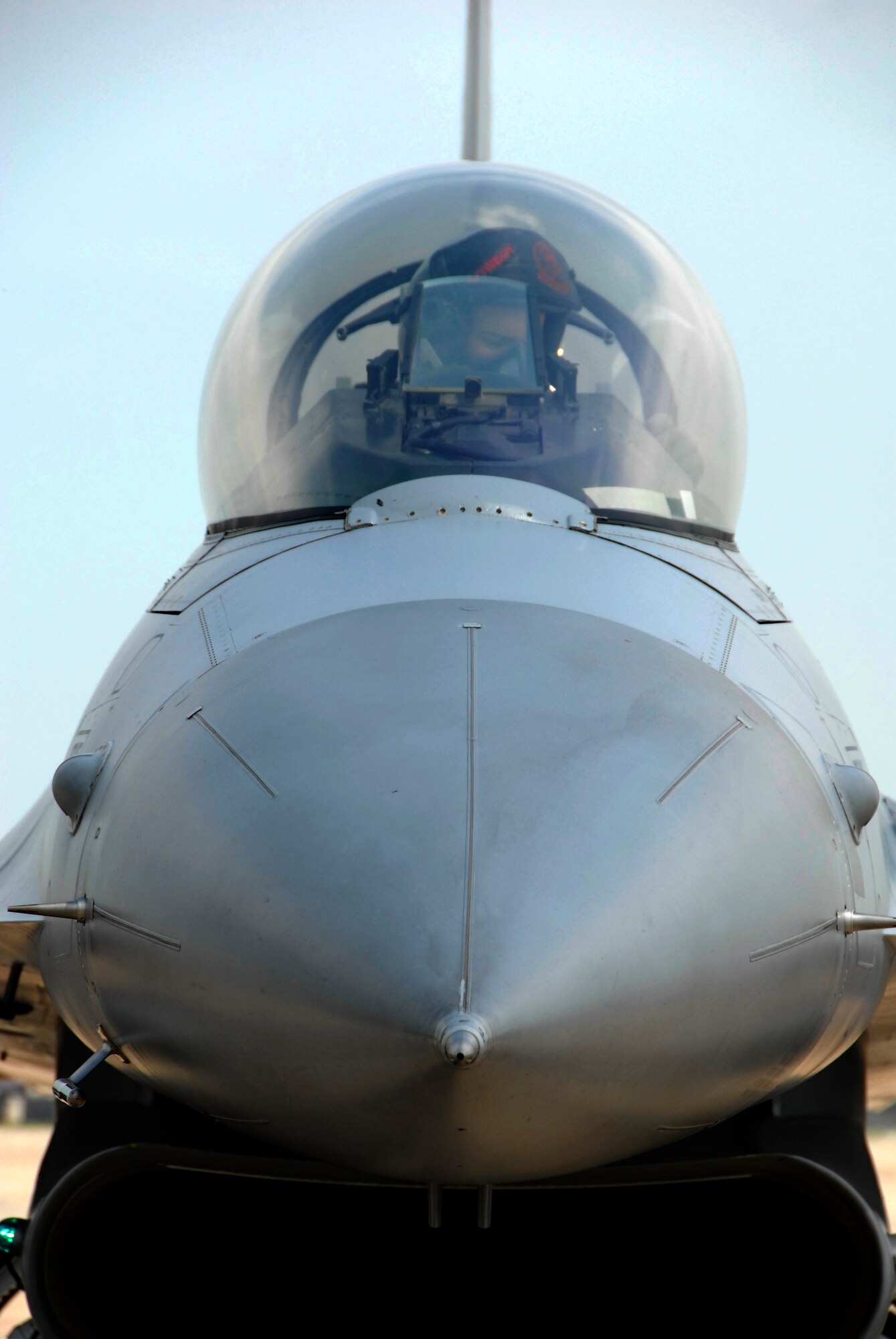 Capt. Chris Gough, an F-16 pilot, parks an F-16 Fighting Falcon from the 301st Fighter Wing after landing at Whiteman Air Force Base, Mo., May 13, 2009.  Captain Gough and other Citizen Airmen from the 301st traveled to Whiteman from Naval Air Station, Joint Reserve Base Fort Worth, Texas, to assist the 442nd Fighter Wing with an exercise May 14 to 17.  The F-16 pilots provided air-to-air agressor training for the 442nd Fighter Wing's A-10 Thunderbolt II pilots who were simulating flying combat sorties over central Missouri.  (U.S. Air Force photo/Maj. David Kurle)  