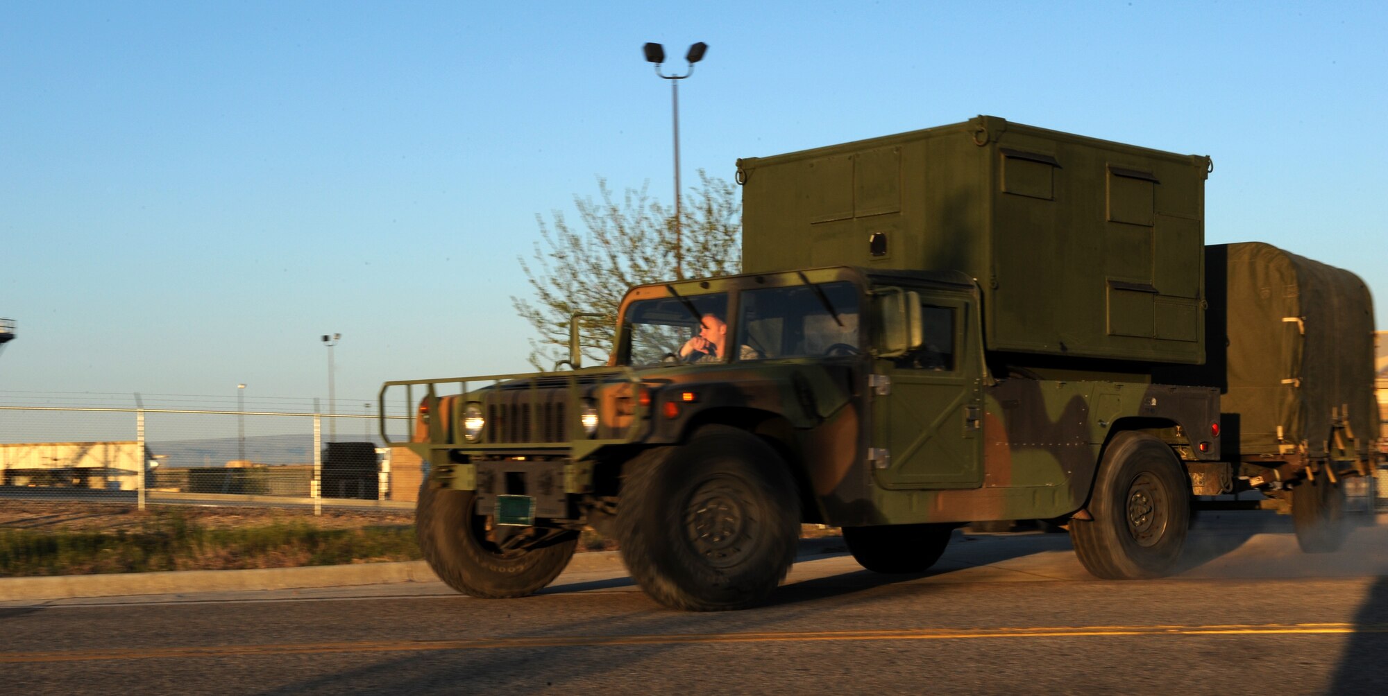 MOUNTAIN HOME AIR FORCE BASE, Idaho -- Lt. Col. Bryan Gates, 726th Air Control Squadron commander, walks to the lead vehicle in the convoy leaving Mountain Home Air Force Base for a week-long training exercise in Wendover, Utah, May 8. The 726th ACS tackles a wide-spread mission including enemy surveillance and identification, weapons control, joint and combined data-link connectivity, and battle management of offensive and defensive air activities. The squadron is made up of 27 different Air Force career fields, making it self-sustaining and able to deploy and fully operate without external support or help. (U.S. Air Force photo\Airman 1st Class Debbie Lockhart)