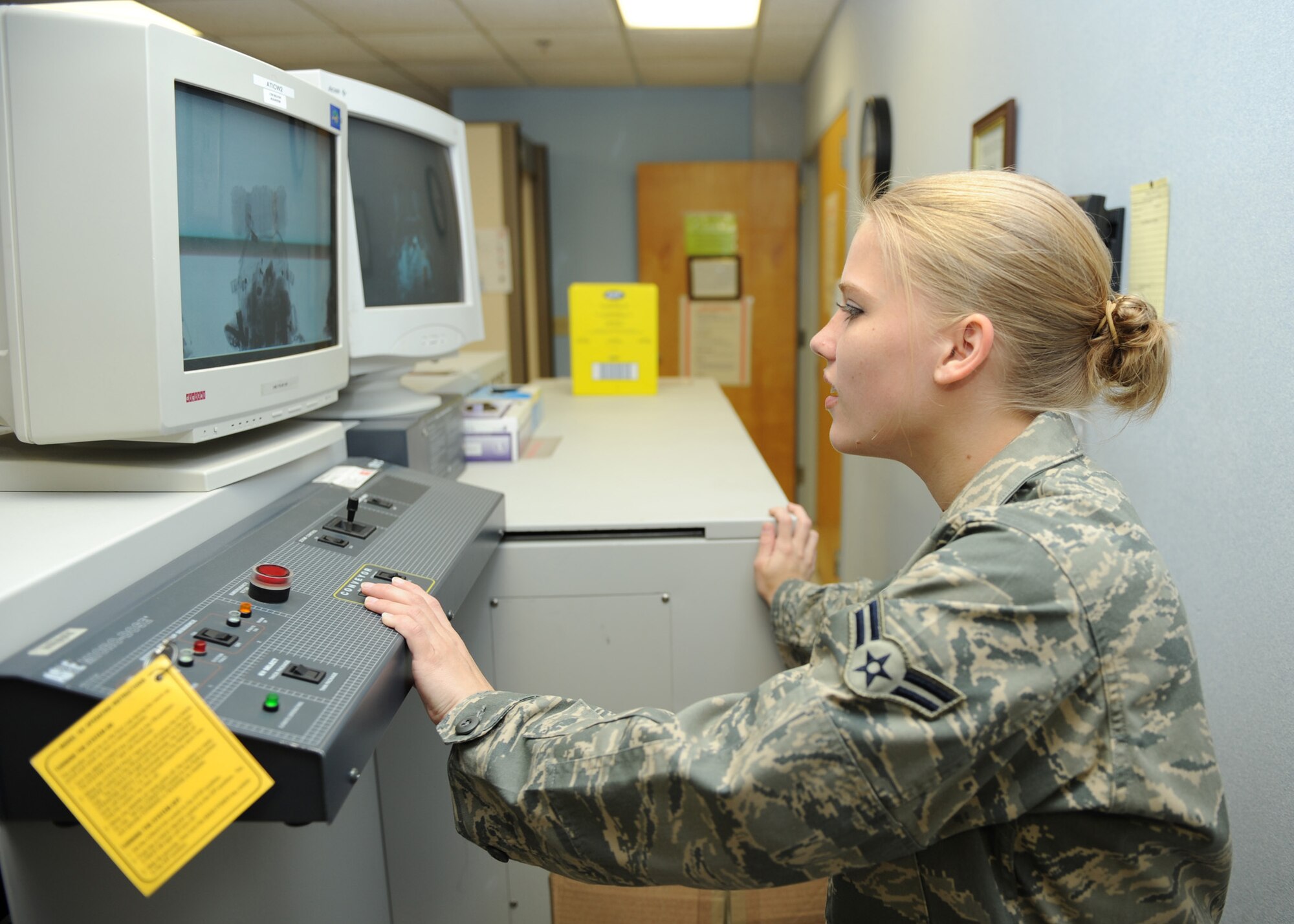 SCOTT AIR FORCE BASE, Ill. -- Airman 1st Class Kristen Todd, 375th Aeromedical Staging Facility aeromedical evacuation clerk, screens luggage for prohibited items before they are loaded onto aircraft at Scott May 18. (U.S. Air Force photo/Staff Sgt. Paul Villanueva II)