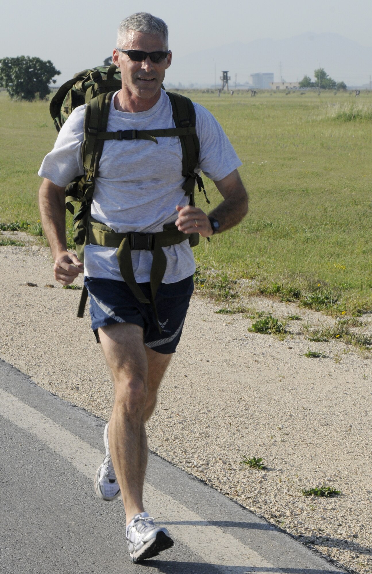 Lieutenant Col. Pete York, 39th Air Base Wing, passes the water break table and keeps trucking during Police Week’s ruck sack march, May 15, 2009 at Incirlik Air Base, Turkey. In the end, Colonel York was the first individual to finish. More than 30 Airmen participated in the event, carrying about 30 pounds of field equipment in their ruck’s, and walked or ran Incirlik’s 2.25 mile “Triangle”.  (U.S. Air Force photo/Airman 1st Class Amber Russell)