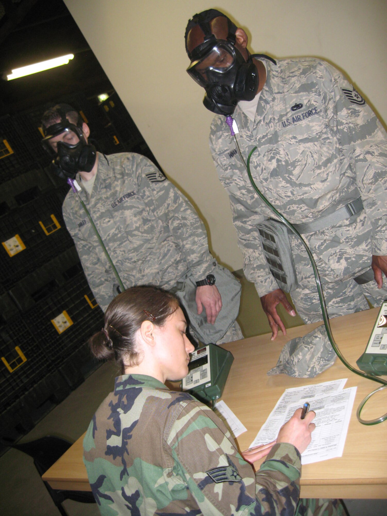 SPANGDAHLEM AIR BASE, Germany – Senior Airman Sarah Cox, 52nd Civil Engineer Squadron, conducts gas mask fit tests on Airmen who were just issued an M-50 gas mask May 15, 2009. Airmen at the 52nd Fighter wing are in the process of turning in their MCU-2A/P masks for the M-50 mask. The new mask offers the same level of protection against chemical, biological and radiological threats as the old style mask; however, has an improved head harness, a wider view, easier access to the drinking tube and dual filters. (U.S. Air Force photo by Tech. Sgt. Tammie Moore)