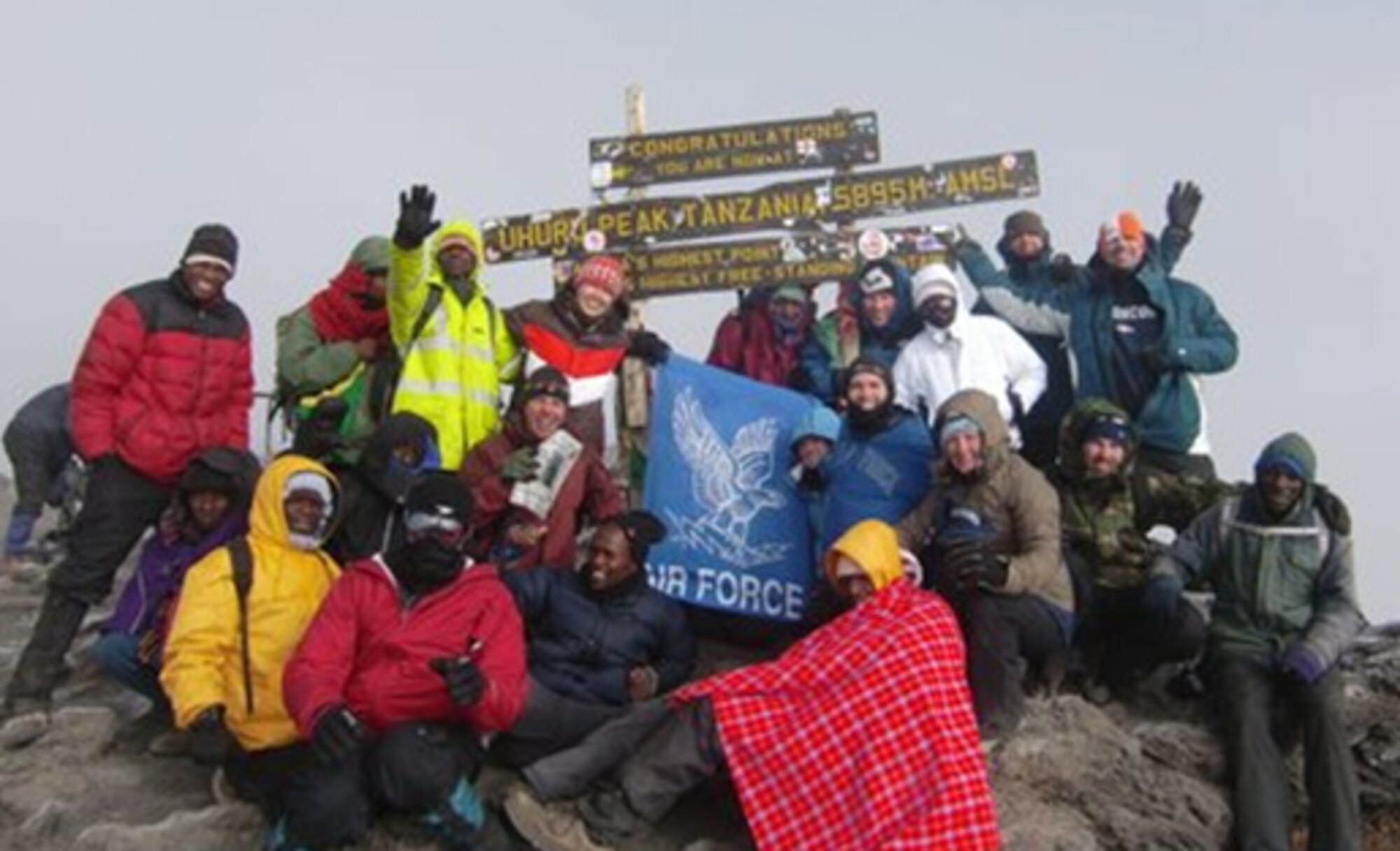 MOUNT KILIMANJARO, Tanzania -- USAF 7 Summit members pictured with their guides atop Mount Kilimanjaro after their four day climb to the top of Africa’s highest point. (Courtesy photo) 