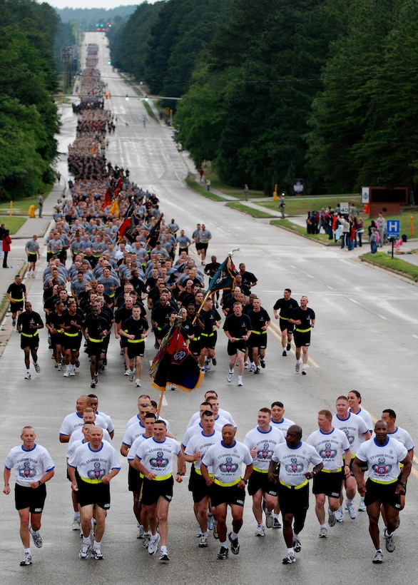 The command group of the 82nd Airborne Division, including Division Commander Maj. Gen. Curtis Scaparrotti, third from left, and Division Command Sergeant Major, Command Sgt. Maj. Thomas Capel, fourth from left, leads thousands of paratroopers on a four-mile division run to kick off the 82nd Airborne’s All American Week celebration, May 18, 2009.
