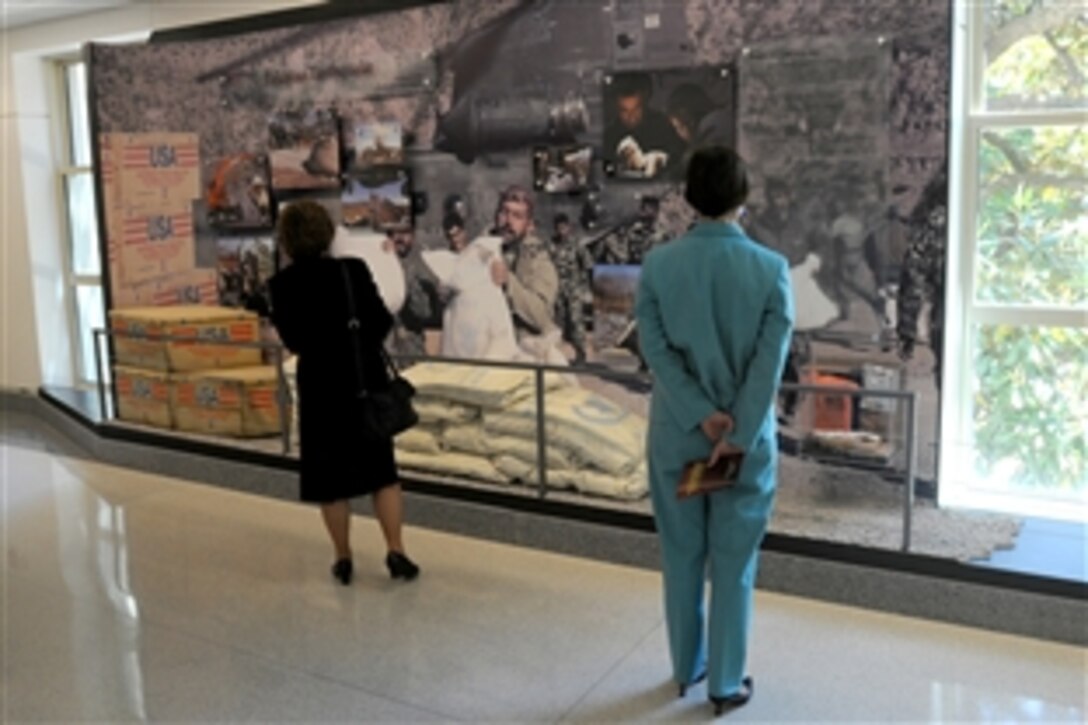 Visitors look at displays in the "Humanitarian Relief Efforts at Home and Abroad" corridor after the corridor's dedication ceremony in the Pentagon in Washington, D.C., May 19, 2009. 