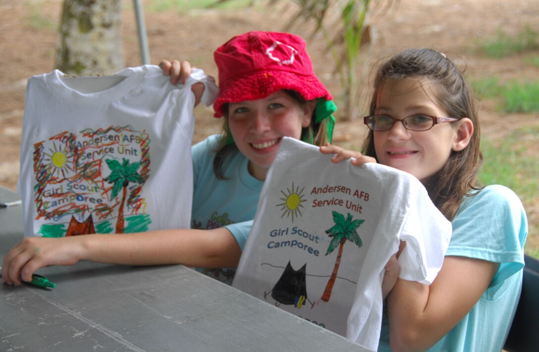 ANDERSEN AIR FORCE BASE, Guam - Kayla Fanning and Rheanne Elledge, both members of Junior Girl Scout Troop 038, show off their T-shirt designs during the first Andersen Service Unit Girl Scouts Camporee held May 16 at Tarague Beach. Each scout participating in the camporee received an opportunity to make their own T-shirt to remember the experience. (U.S. Air Force photo by Senior Airman Shane Dunaway)