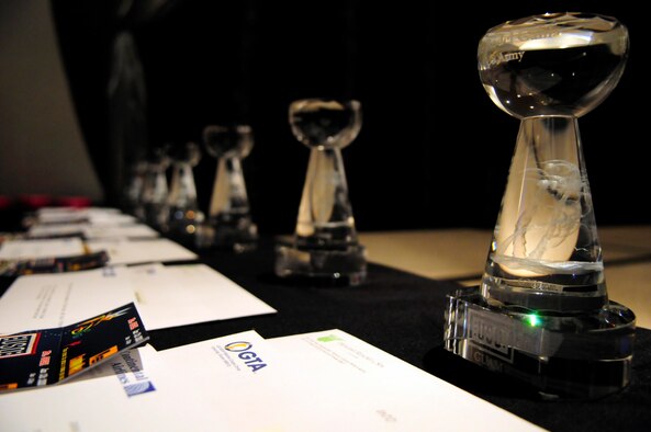 ANDERSEN AIR FORCE BASE, Guam - USO Servicemember of the Year glass latte stone awards are lined up beside the stage prior to a USO Gala dinner at the Hyatt Hotel May 16. The awards were presented to outstanding military members from each service on Guam during 2008. (U.S. photo by Airman 1st Class Courtney Witt)