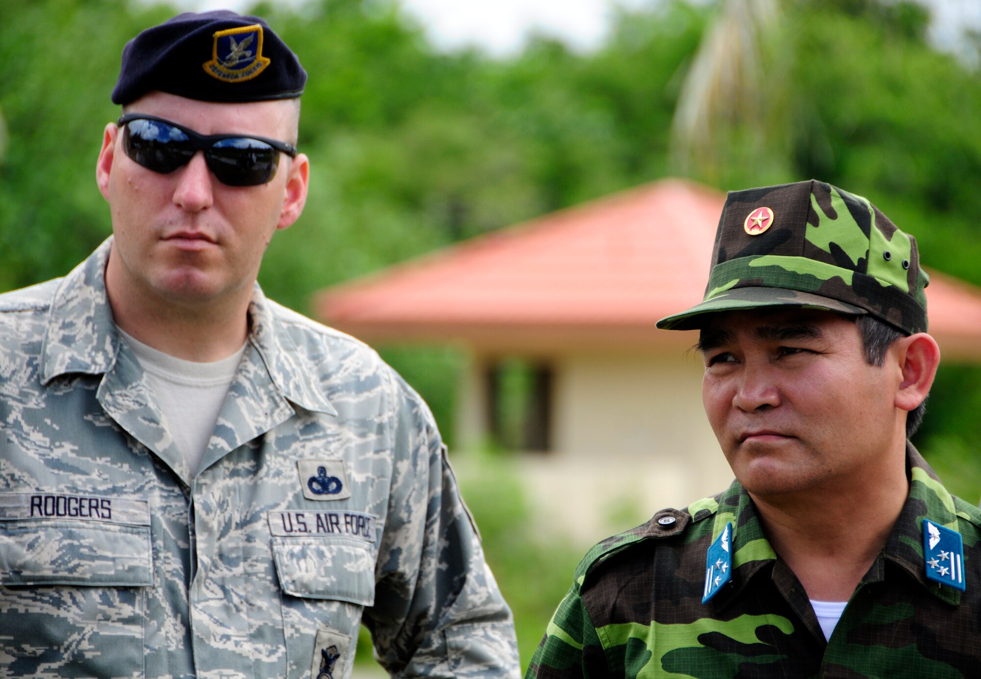 ANDERSEN AIR FORCE BASE, Guam - Master Sgt. Paul Rodgers, 736th Security Forces Commando Warrior Cadre, and Vietnam Col. Tran Van Thuan listen as Commando Warrior cadre explains the benefits of training with simulated improvised explosive devices at Andersen South, May 19. Colonel Thuan and members of the Indonesian military visited Andersen as part of a Subject Matter Expert Exchange with Air Force personnel. (U.S. Air Force photo by Airman 1st Class Courtney Witt)
