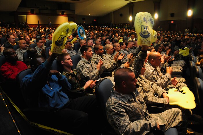Members of the 437th Security Forces Squadron cheer with pride as the results of the Air Mobility Command’s Unit Compliance Inspection are read aloud at the base theater here May 20. After a week of inspections, Team Charleston gathered together as the UCI team announced the 437th Airlift Wing was rated “excellent” overall, surpassing Air Force standards. (U.S. Air Force photo/Staff Sgt. Daniel Bowles)