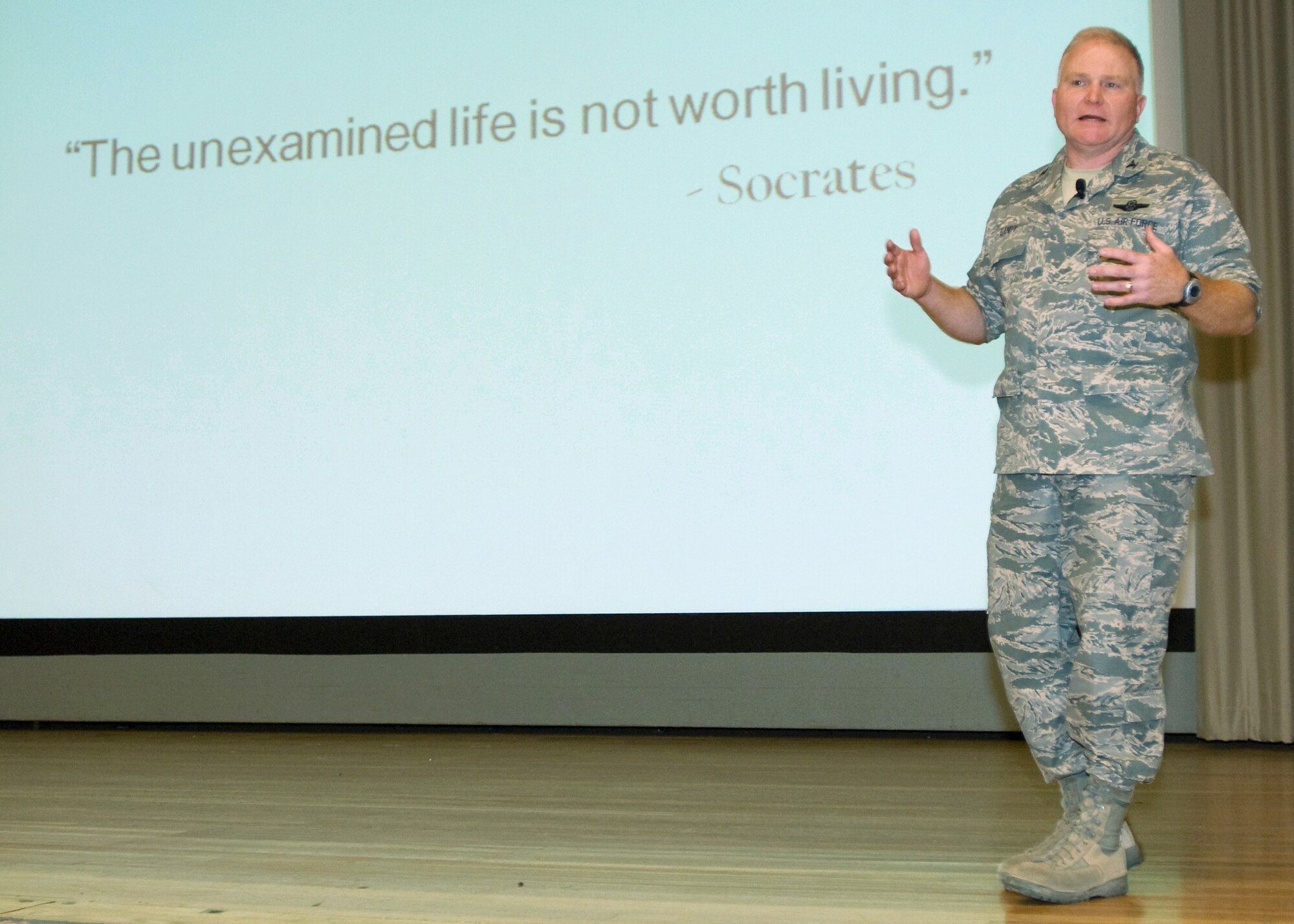Col. Jerry Gandy, 95th Air Base Wing commander, talks to wing personnel about ruts  and identifying them in ones performance during his commander's call in the base theater May 14. He also discussed the importance of Airmen investing in their careers and career fields. (Air Force photo/Heather Anhalt)