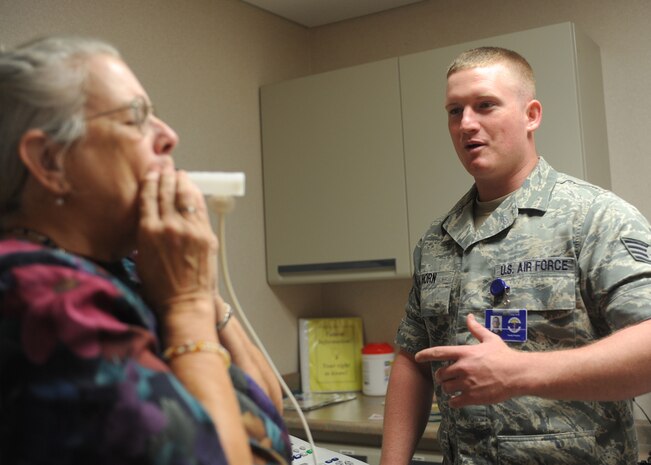 Staff Sgt. Gary Horn administers a pulmonary function test to Mary Surface at the Charleston AFB medical clinic May 15. During the first quarter of 2009, he assisted in providing in-house care to 13,085 patients. Sergeant Horn was recently awarded the Purple Heart after a deployment to the Middle East and is a medical technician with the 437th Medical Group. Mrs. Surface is the spouse of a retired military member. (U.S. Air Force photo/Senior Airman Katie Gieratz) (Released)