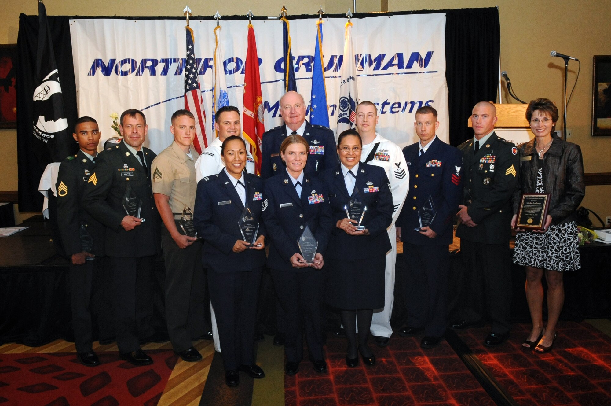 AURORA, Colo. -- The winners of the 33rd Annual Armed Forces Recognition Luncheon from left to right, top to bottom: Army Sgt. Adam Jones, Army Active Duty; Army Sgt. Jay Maitri, Army Reserve; Marine Cpl. G.J. Southards, Marine Corps Reserve; Petty Officer 1st Class Richard Wyatt, Navy Active Duty; Maj. Gen. Thomas Deppe, Air Force Space Command Vice Commander; Petty Officer 1st Class Delmas Rowe, Navy Reserve; Petty Officer 1st Class Brian Wiggins, Coast Guard; Army Sgt. Marcus Landis, Colorado Army National Guard; Sheila Anthony, City of Aurora Senior Center; Capt. Aliesha Best accepting on behalf of Senior Airman Robyn Ryder, Colorado Air National Guard; Tech. Sgt. Stacy Wilfong, Air Force Active Duty; Tech. Sgt. Ana Frias accepting on behalf of Senior Airman Daniel Kendall, Air Force Reserve. These members of Team Buckley and the community were recognized as exceptional performers by The Aurora Chamber of Commerce and local businesses that sponsored the event May 15 at the Crowne Plaza here. (U.S. Air Force photo by Senior Airman John Easterling)
