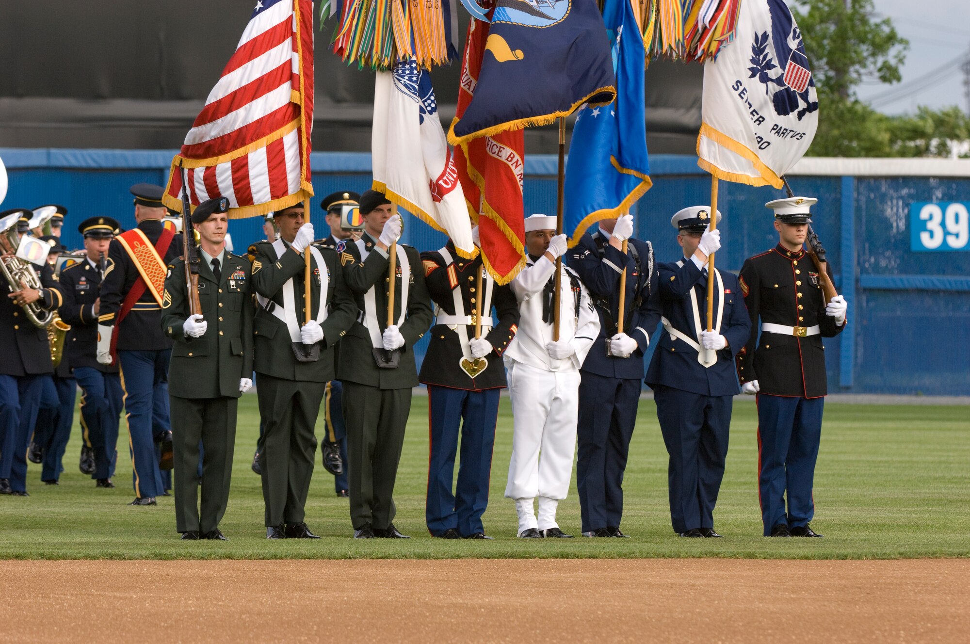 NORFOLK, Va -- A joint military color guard stands at attention in the outfield at Harbor Park during the opening ceremony of the Norfolk Tides baseball club's 14th annual Military Appreciation Night May 16. (DOD photo/Staff Sgt. Joe Laws) 