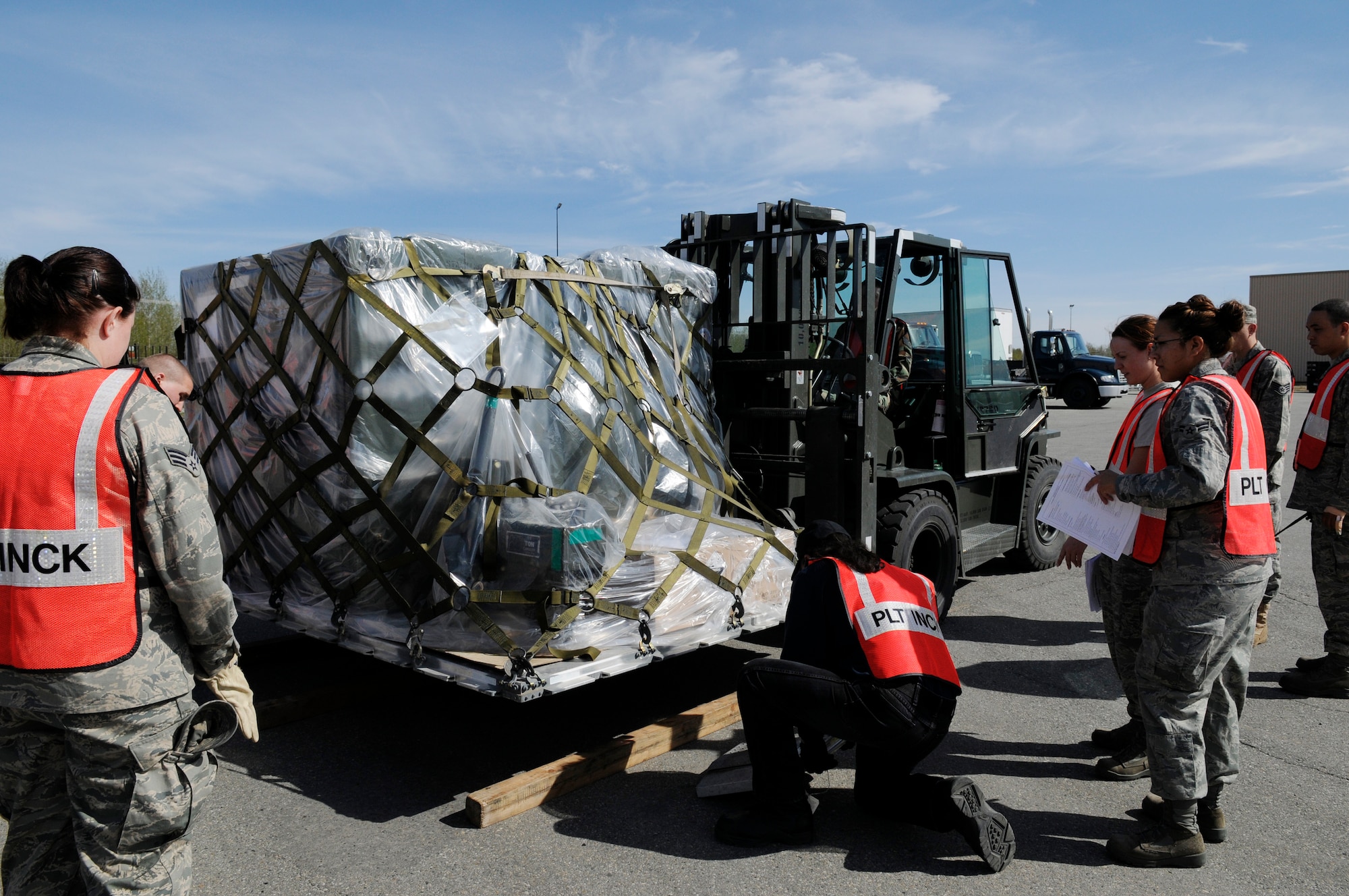Airmen prepare supplies to be shipped during an operational readiness exercise May 18, 2009, Eielson Air Force Base, Alaska. The O.R.E. tests the bases' ability to prepare, enable, and deploy on a moments notice. The Airmen are assigned to the 354th Logistics Readiness Squadron. (U.S.  Air Force photo/Airman 1st Class Laura Max)
 
