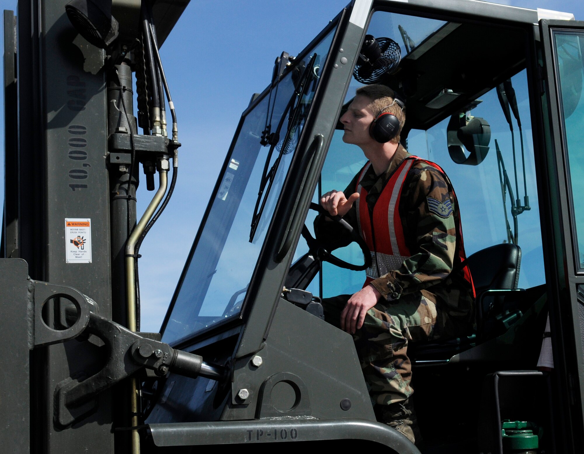 Staff Sgt. Joshua Poe uses a 10-K fork lift to move supplies to be weighed prior to loading it on a plane May 18, 2009, Eielson Air Force Base, Alaska. The weight of the supplies must be calculated before it can be loaded onto the plane. Sergeant Poe is assigned to the 354th Logistics Readiness Squadron Fuel Systems Repair shop. (U.S.  Air Force photo/Airman 1st Class Laura Max)
 
