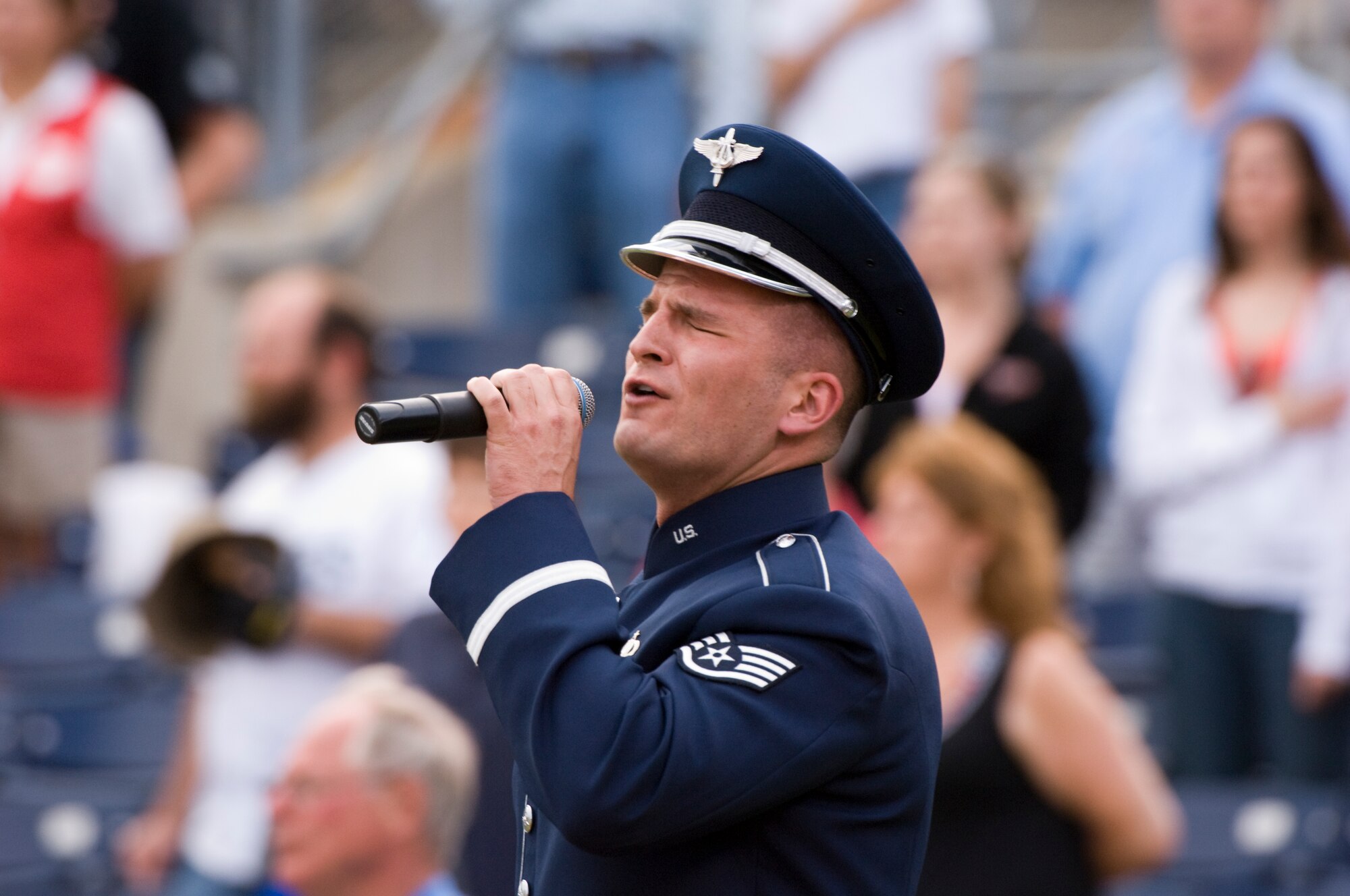 NORFOLK, Va -- Air Force Staff Sgt. Craig Bowman sings the national anthem during the opening ceremony of the Norfolk Tides baseball club's 14th annual Military Appreciation Night at Harbor Park May 16. Sergeant Bowman is a member of Air Combat Command’s Heritage of America Band at Langley Air Force Base, Va. (DOD photo/ Staff Sgt. Joe Laws) 