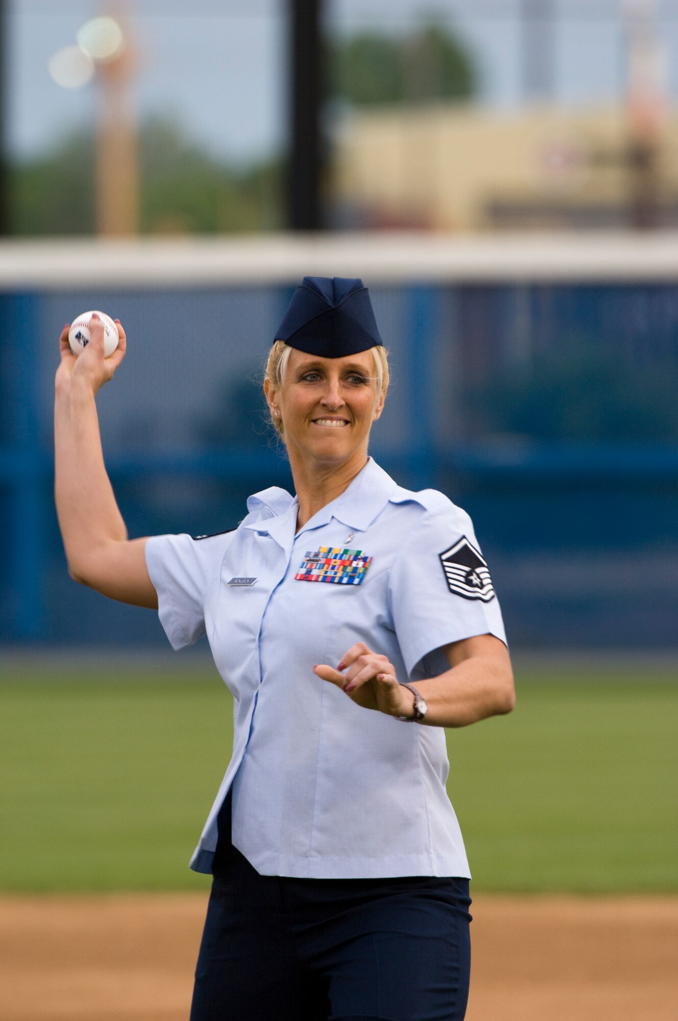 NORFOLK, Va. -- Air Force Master Sgt. Bonnie McKusick throws out the first pitch during the during the opening ceremony of the Norfolk Tides baseball club's 14th annual Military Appreciation Night at Harbor Park May 16. Sergeant McKusick currently serves as flight chief, multi-service unit, 1st Inpatient Operations Squadron at Langley Air Force Base, Va. (DOD photo/Staff Sgt. Joe Laws)