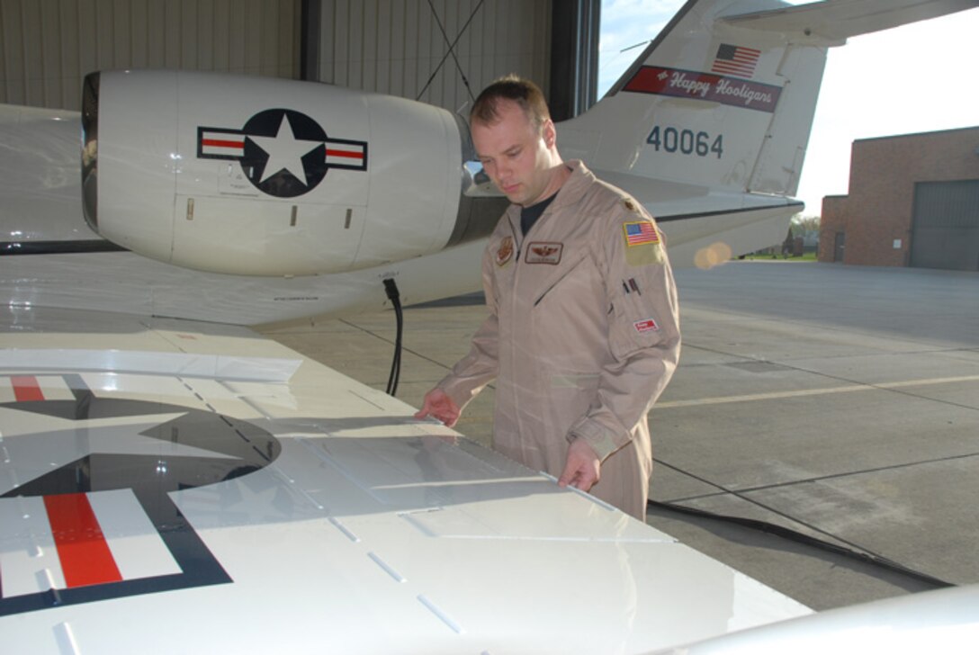 Maj. Jason Newham, of the 177th Airlift Squadron, North Dakota Air National Guard does a pre-flight inspection of a C-21 at the North Dakota Air National Guard May 20, Fargo, N.D.  This is the first time that the North Dakota Air National Guard C-21s have deployed to southwest Asia in support of Operation Enduring Freedom.  The Airmen will be supporting the mission in alternating shifts throughout the summer.  The 119th Wing began flying the C-21 Lear Jets after the unit lost their F-16 Fighting Falcons in January 2007.  (DoD photo by Senior Master Sgt. David H. Lipp) (Released)
