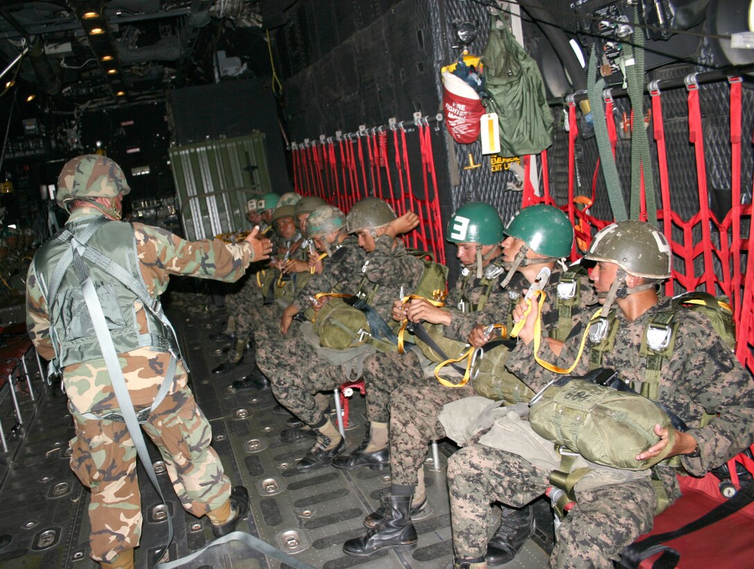 A group of Honduran "paracaidistas" -- paratroopers -- prepare to jump from a U.S. Air Force HC-130 May 16 over Soto Cano AB, Honduras. Nearly 200 U.S. Army and Honduran jumpers, along with 10 U.S. Air Force aircrew members, participated in the combined training. (Courtesy photo)