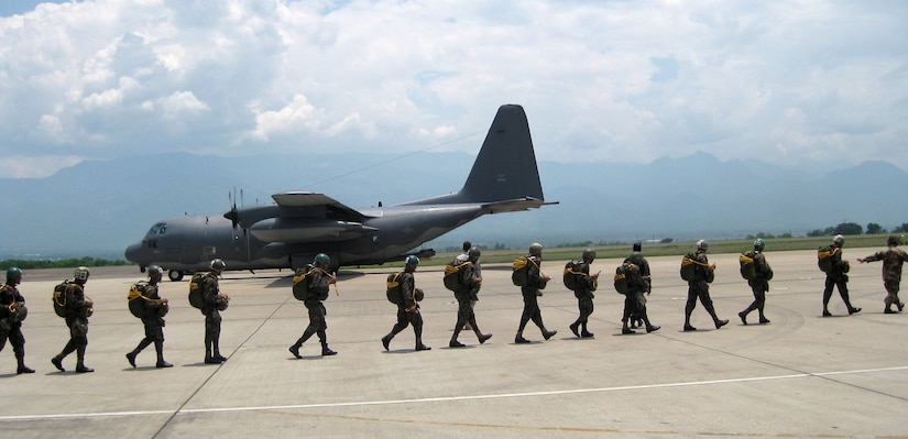 A group of Honduran "paracaidistas" -- paratroopers -- prepare to board a U.S. Air Force HC-130 May 16 at Soto Cano AB, Honduras. Nearly 200 U.S. Army and Honduran jumpers, along with 10 U.S. Air Force aircrew members, participated in the combined training. (Courtesy photo)