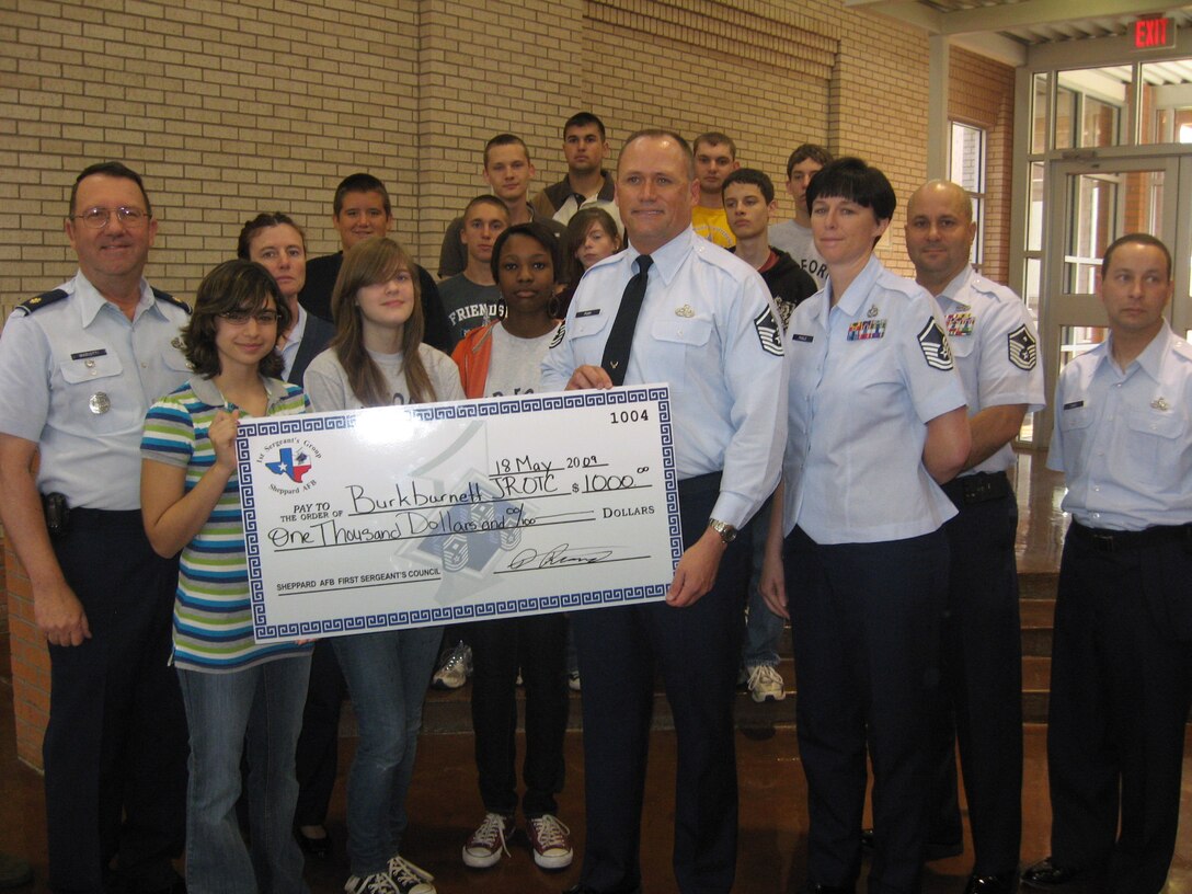 The Sheppard First Sergeant’s Council presented a $1,000 check to the members of Burkburnett High School Junior Reserve Officers’ Training Corps May 18 at  the high school.(U.S. Air Force photo/Debi Smith)