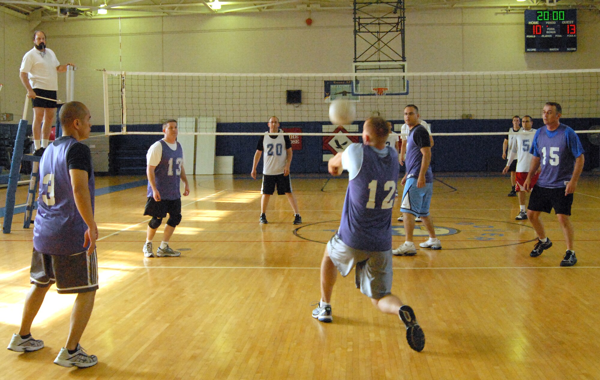 Stephen Hart, 436th Maintenance Operations Squadron, defends a serve from the 436th Communications Squadron during a volleyball match May 18 at the Fitness Center. The MOS team currently holds the title as the number one team in the National League. (U.S. Air Force photo/ Airman 1st Class Shen-Chia Chu) 
